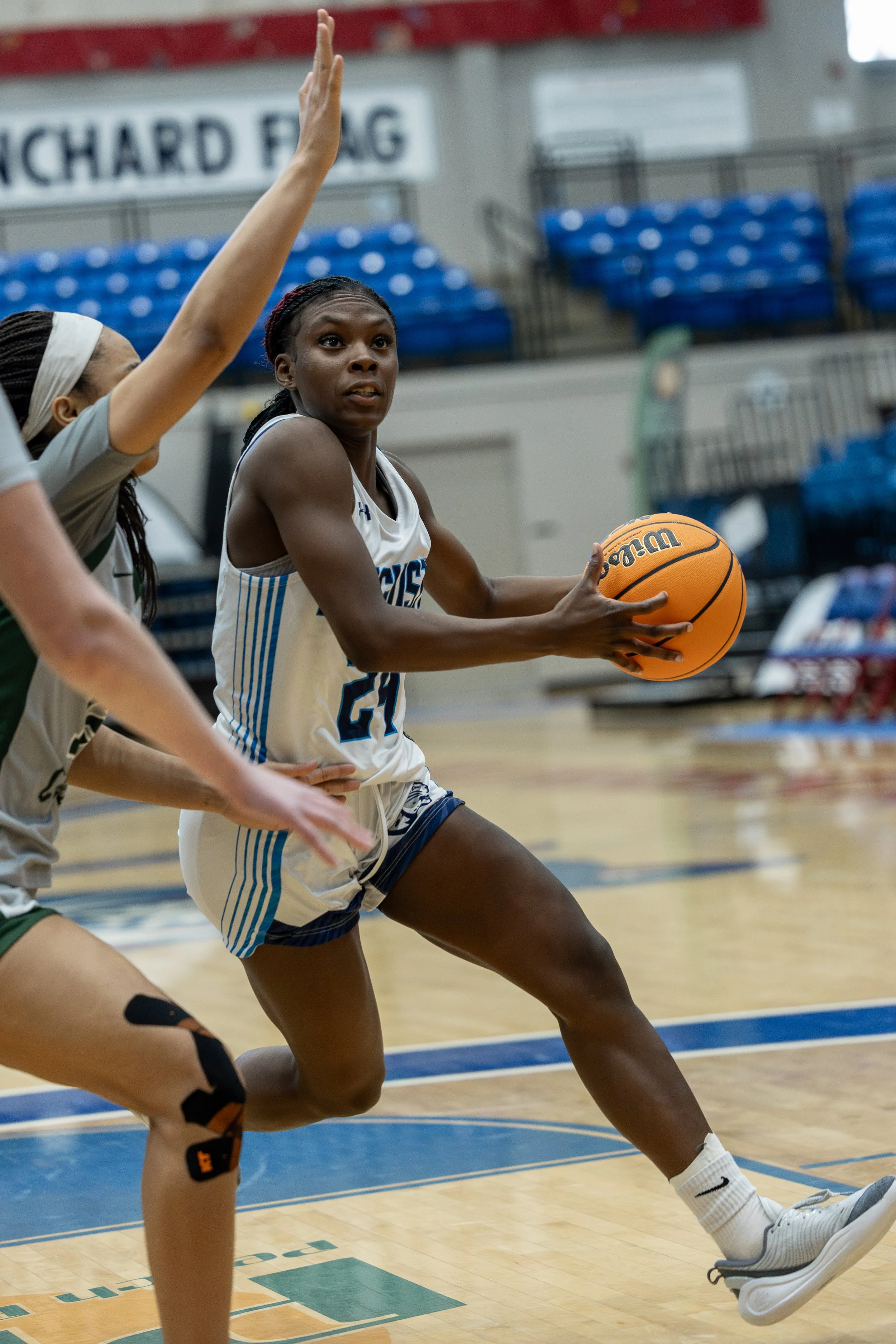  Quinasia Abercrombie (24) protects the ball as she drives to the basket. Abercrombie finished with 19 points as she led the Jags to their first PBC Championship since 1993. (photo by Lydia Williams/the Bell Ringer) 