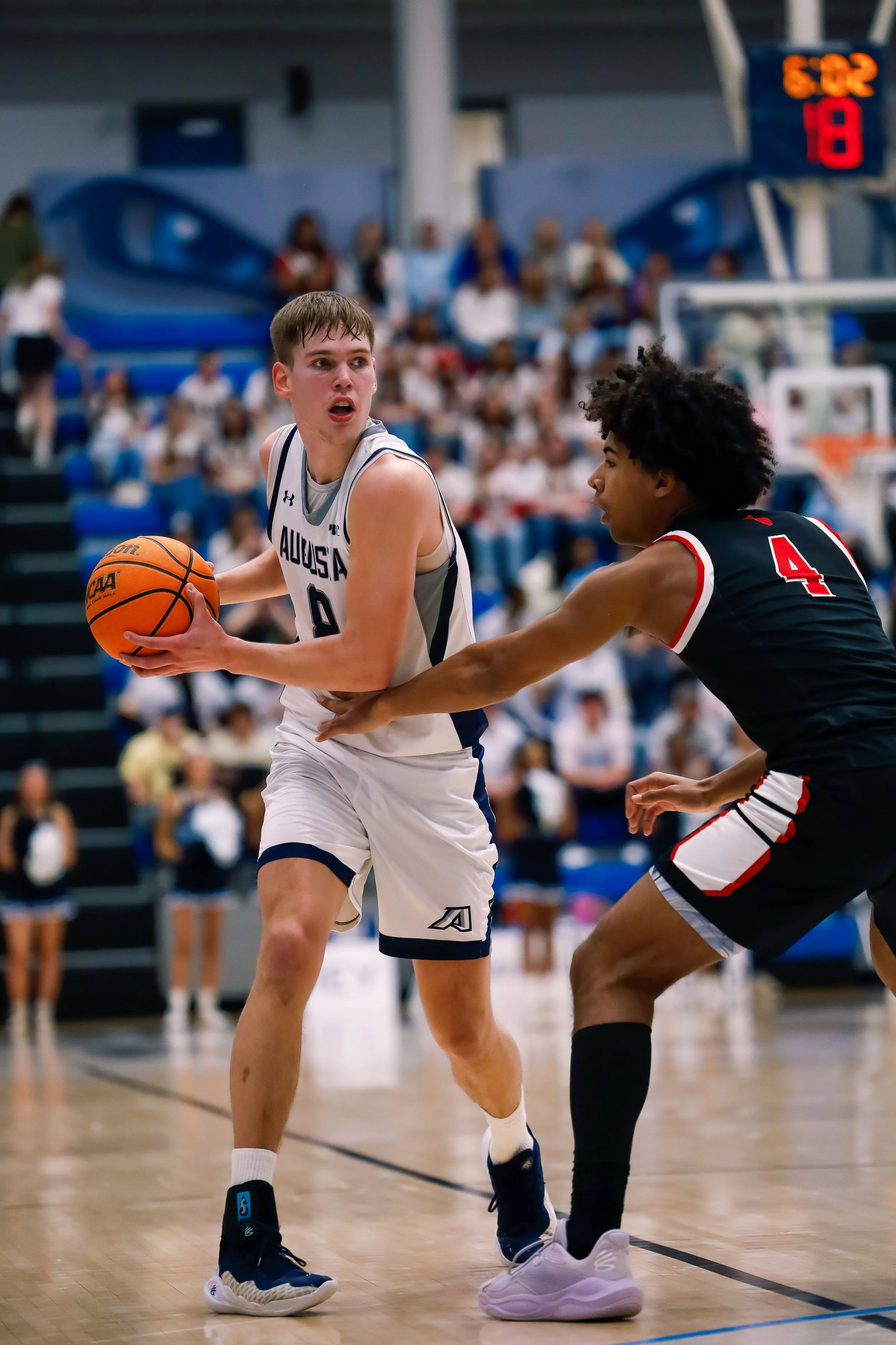  Elias Palsson (8) averaged 7.4 points per game as a freshman, playing nearly 20 minutes per game. He will have to pick up the scoring load after the top three scorers from the 2024-25 team have moved on. At the top of the page, Palsson drives to the hoop, trying to draw the foul. (photos by Lydia Williams/the Bell Ringer) 