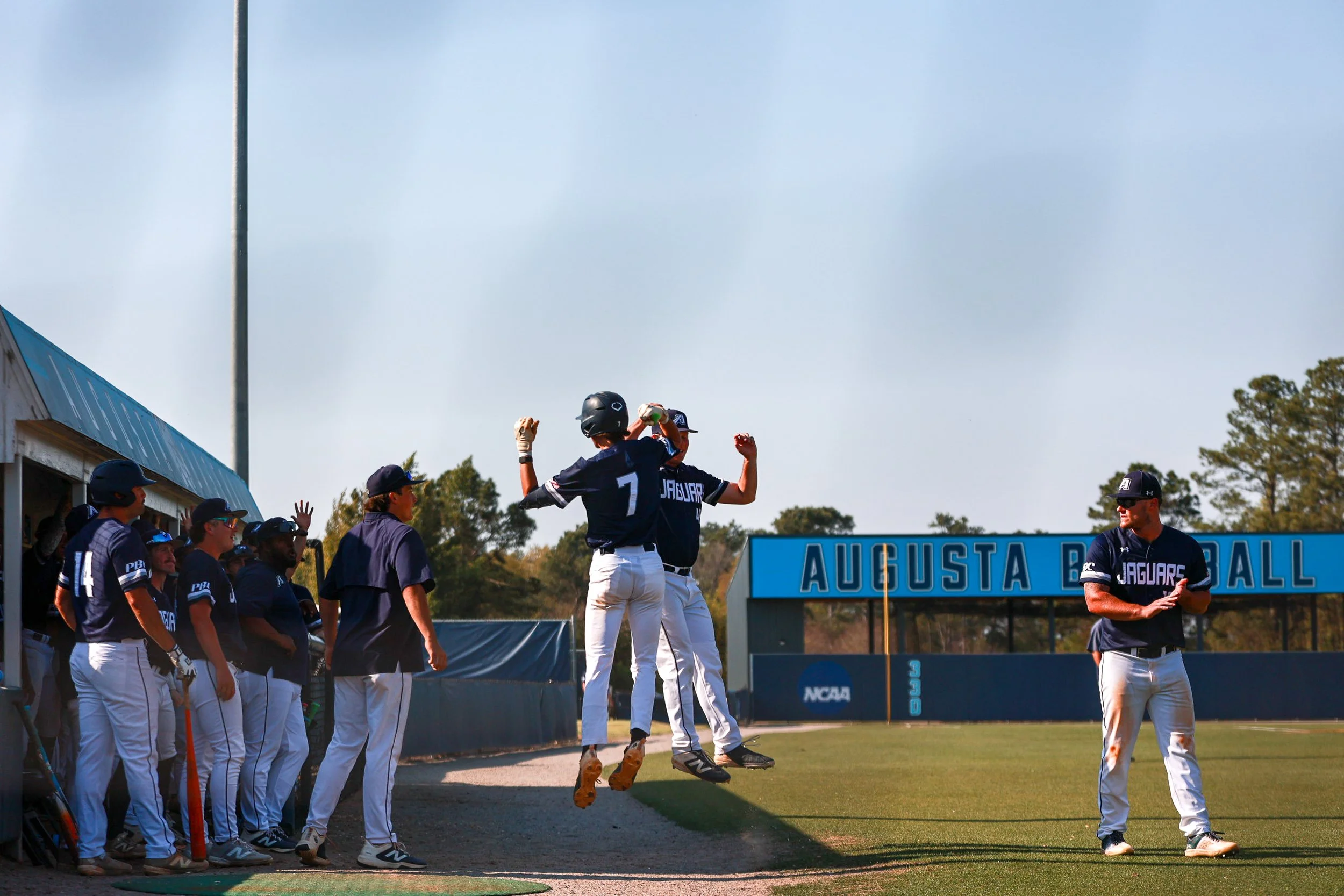 Nolan Turner (7) and Harris Bachelder (41) celebrate Turner’s home run after he crossed home plate. At the top of the page, Turner (7) blasts a homer to center field. (photos by Rodrigo Burgos Avila/the Bell Ringer) 