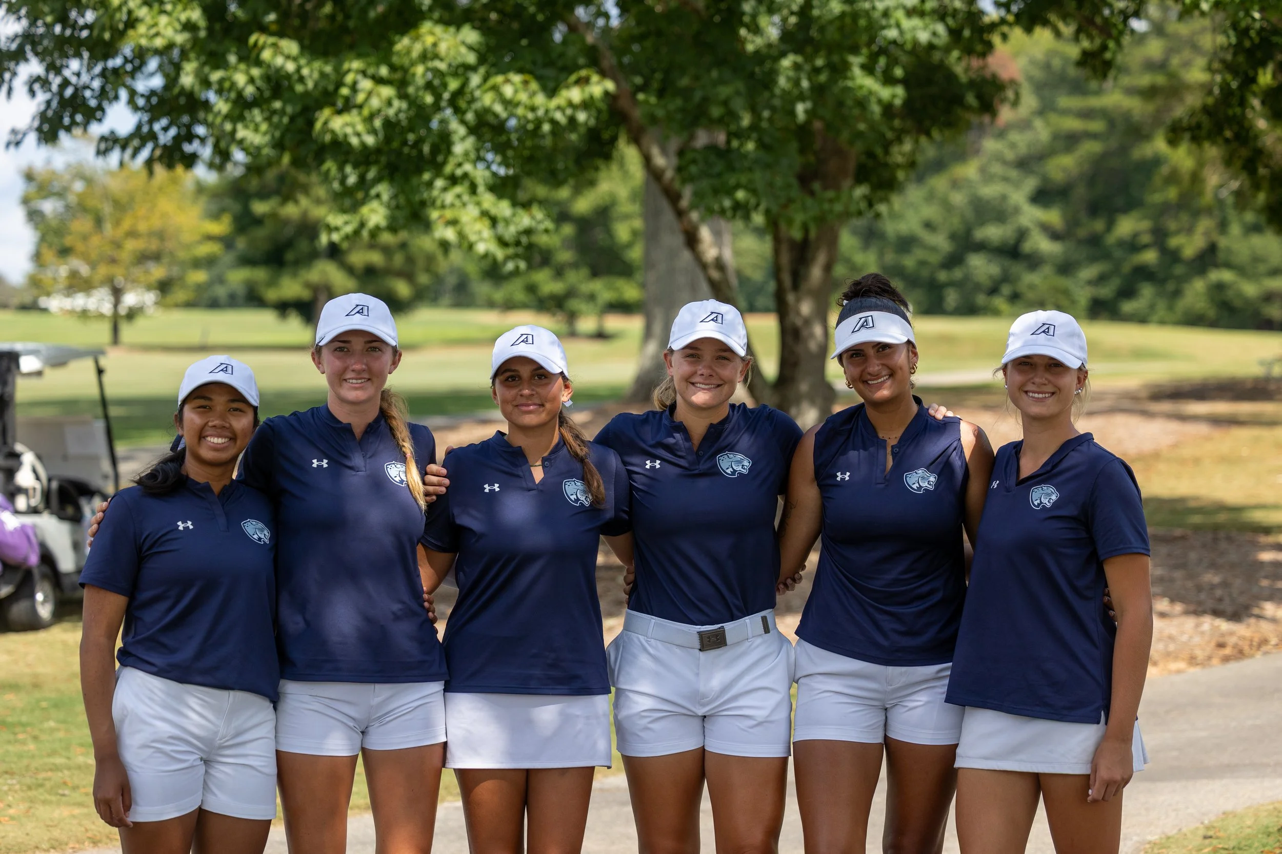  At the top of the page, Sara Adams tees off during the second round of the Lady Paladin Invitational. Below, the Augusta University women’s golf team poses for their first team picture. From left to right, Puntita Pawichai, McKinley Holding, Luciana Reis, Sara Adams, Sofia Valera and Danielle Higbee. (photos by Rodrigo Burgos Avila/the Bell Ringer) 