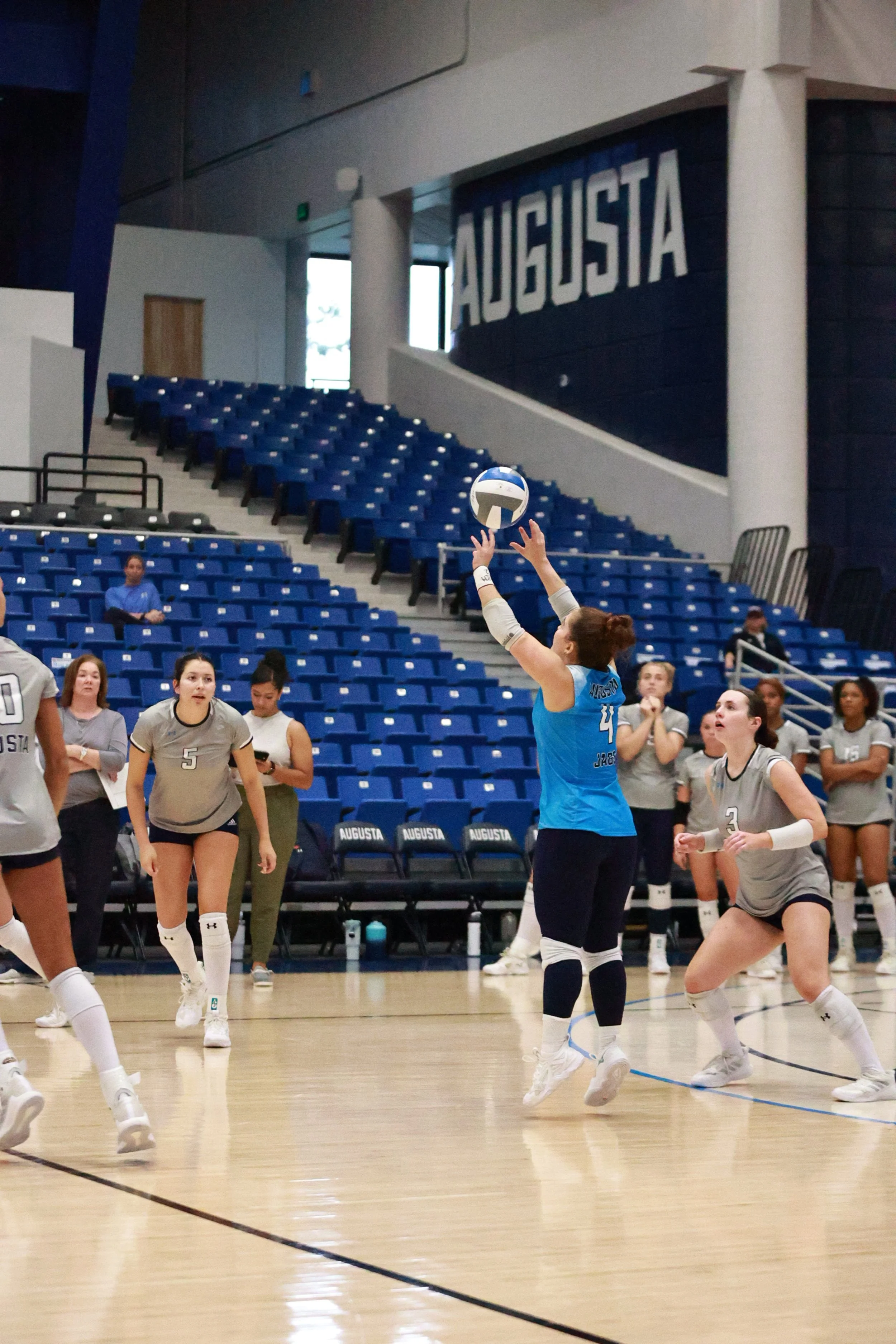  AU libero Giulia Rodrigues (4) sets up the right side for an attack during the Jaguars’ match against the Saints. (photo by Rodrigo Burgos Avila/the Bell Ringer) At the top of the page, Angela Mateos (12) and Sofiia Snitsarevych (11) go up for a block during the match against Flagler on Saturday Oct. 4 at Christenberry Fieldhouse. (photo by Lydia Williams/the Bell Ringer) 