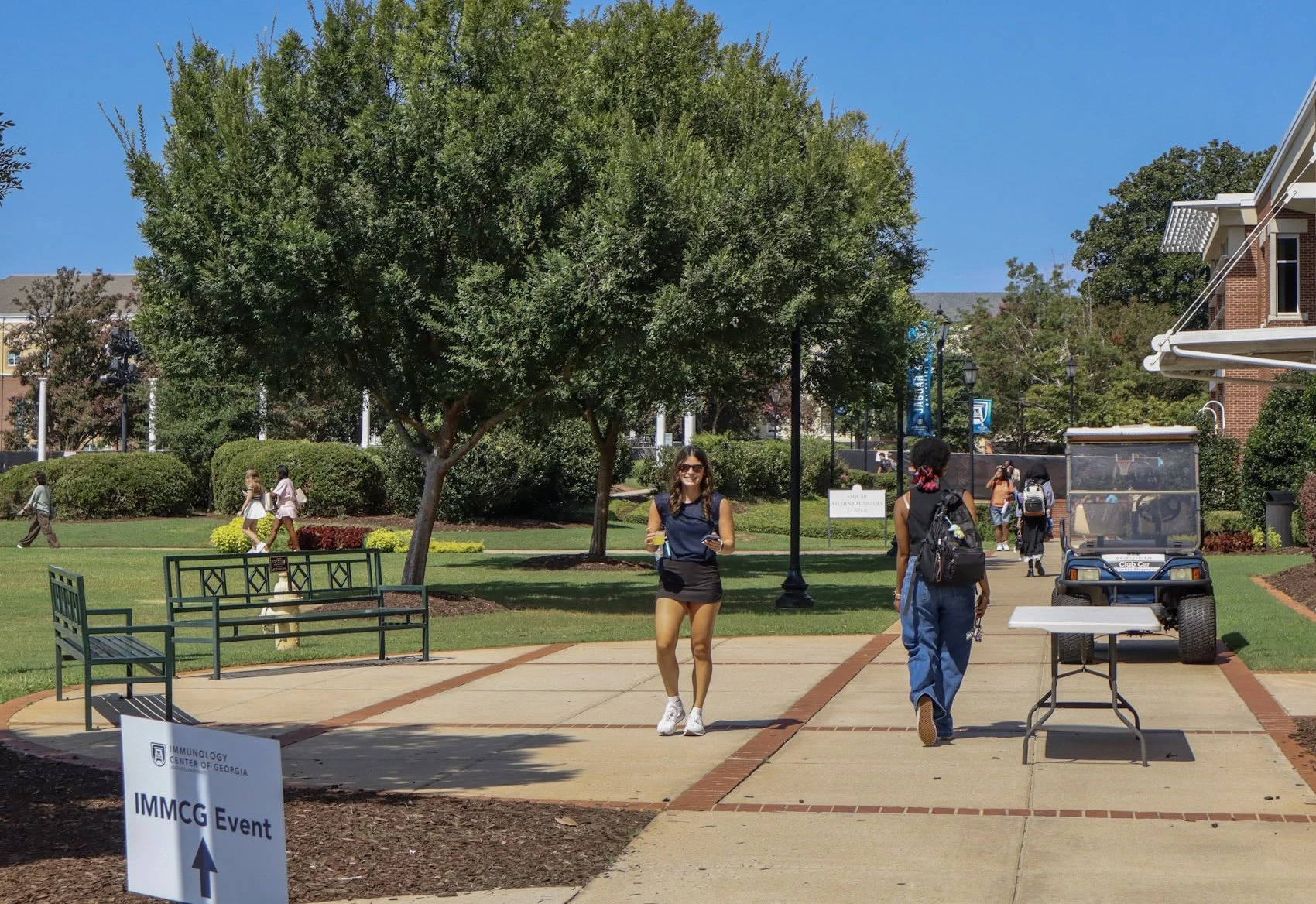  First day of class at AU: Students walk on the Summerville Campus of AU on Tuesday, Aug. 18. It was hot, but there were no clouds in the sky as the Fall 2026 semester got underway. (photo by Anna Biondolillo/the Bell Ringer) 