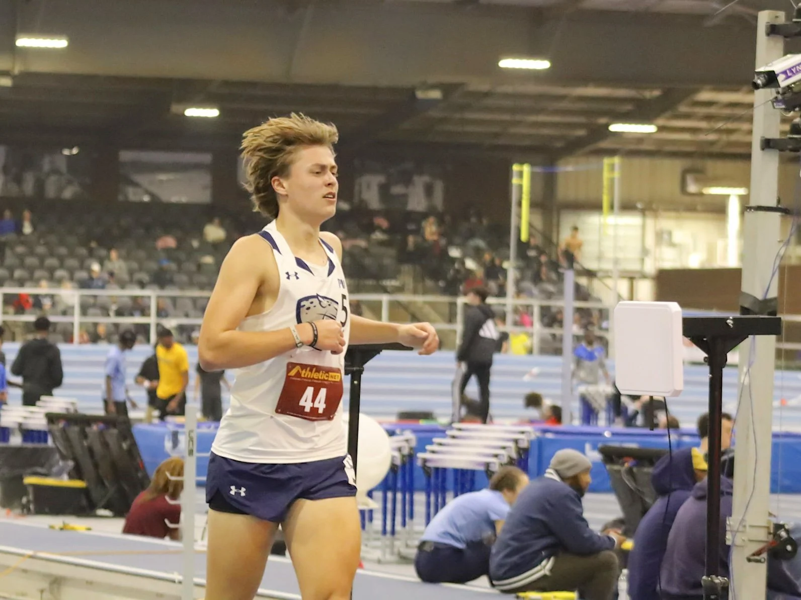  AU’s Brock Ferguson races in his first event as a Jaguar after a long recovery from injury. He ran a time 5 minutes and 2.8 seconds in the mile at the Tryon Banked Invitational. At the top of the page, Augusta’s Thanna Davis finishes off the women's 4×400 relay with a 1:01 400-meter run, which allowed the Jaguars to finish first in their section with a season best time of 4:15.54. (photos by Anna Biondolillo/the Bell Ringer) 