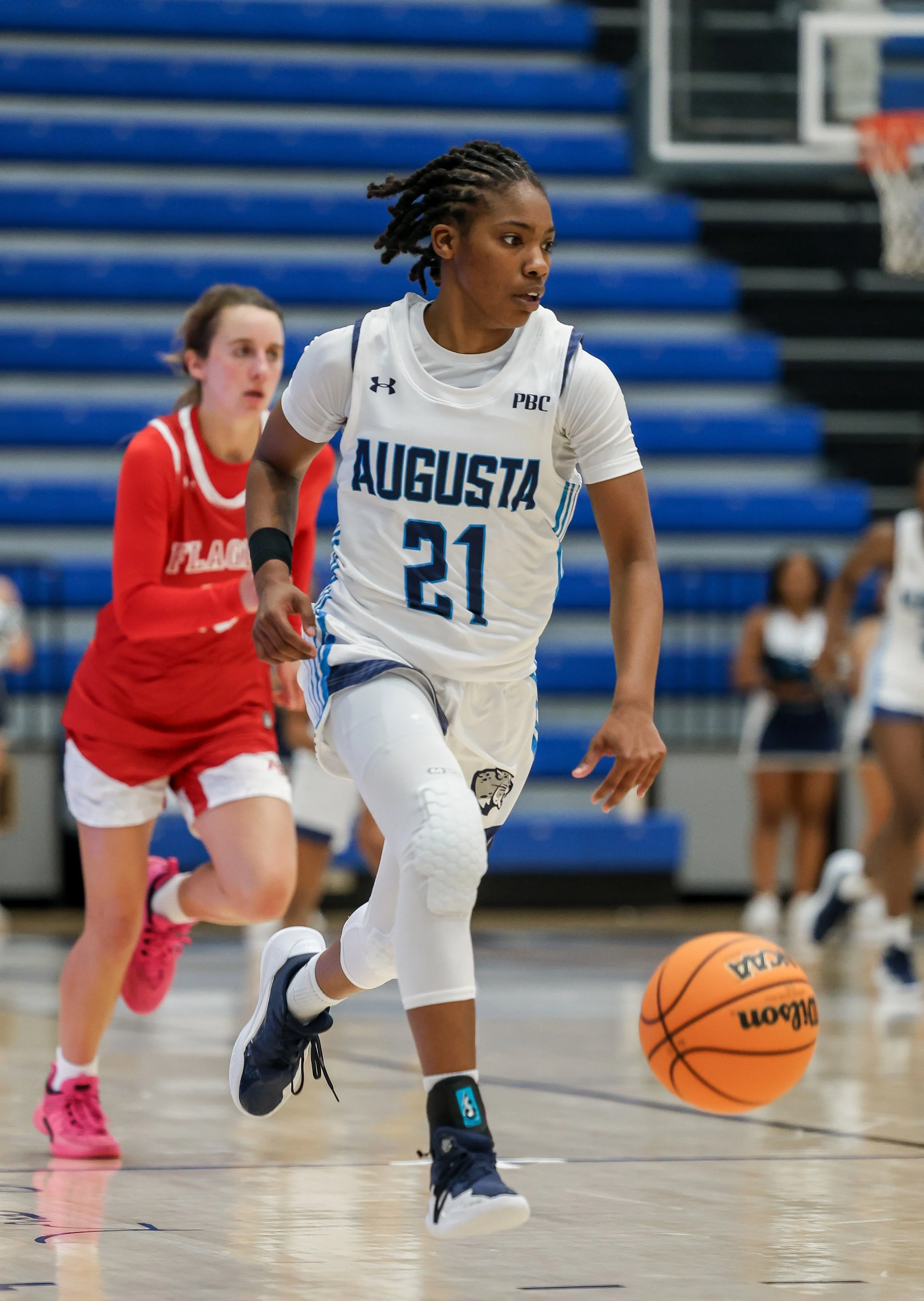  AU’s Elyse Autrey (21) totaled 23 points, five assists and five steals to lead the Jaguars to a big road win over USC Beaufort at The Cove in Bluffton, S.C. At the top of the page, Layne Witherspoon received honorable mention all-American honors from the American Volleyball Coaches Association. (photos by Lydia Williams/the Bell Ringer) 