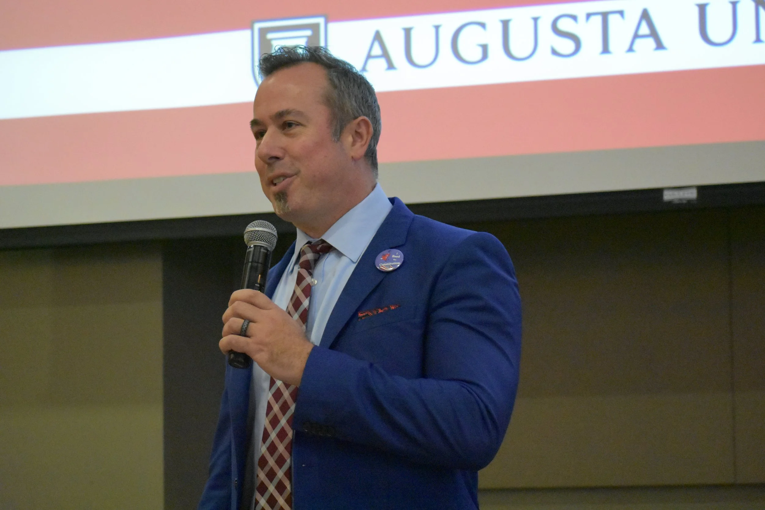  AU Provost Neil MacKinnon shared his experience about obtaining his U.S. citizenship with the audience.  (photo by Liz Wright)  