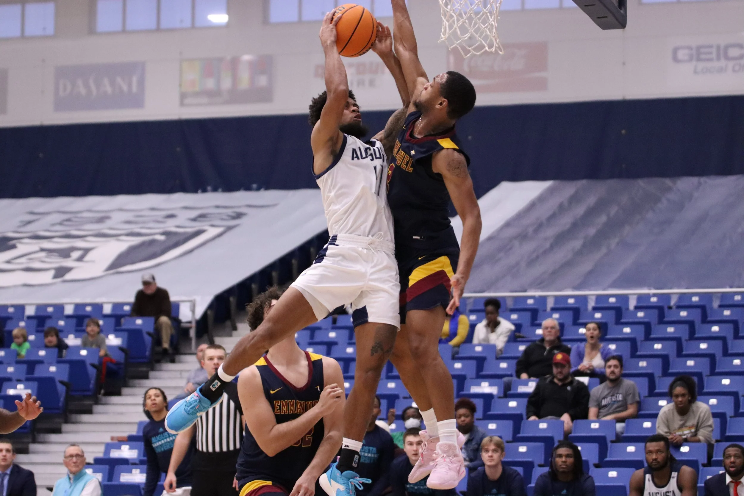  Darren Lucas-White (11) had 9 points, 6 rebounds and 4 steals to help AU get a key road win at Young Harris. At the top of the page, Tyree Myers (2) became the Peach Belt Conference’s all-time leader in assists after he dished out 8 assists in the win over the Lions. (photos by Madison Keel) 