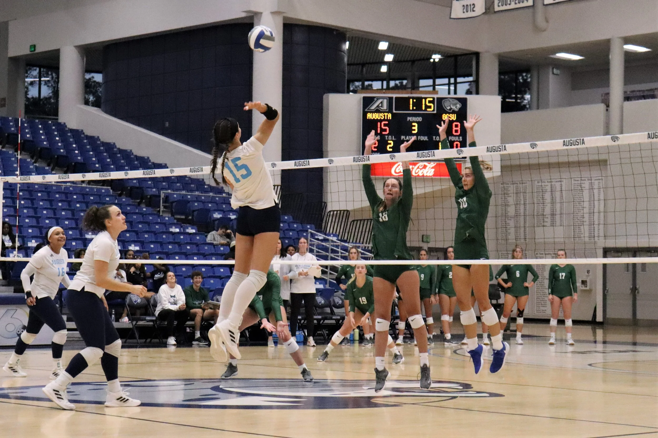  Madelyn Eden (15) goes up for the kill for Augusta University’s volleyball team in its win over Georgia College; Eden had 8 kills for AU. At the top of the page, Jazmyn Wheeler spikes the ball for the Jaguars. (photos by Madison Keel) 