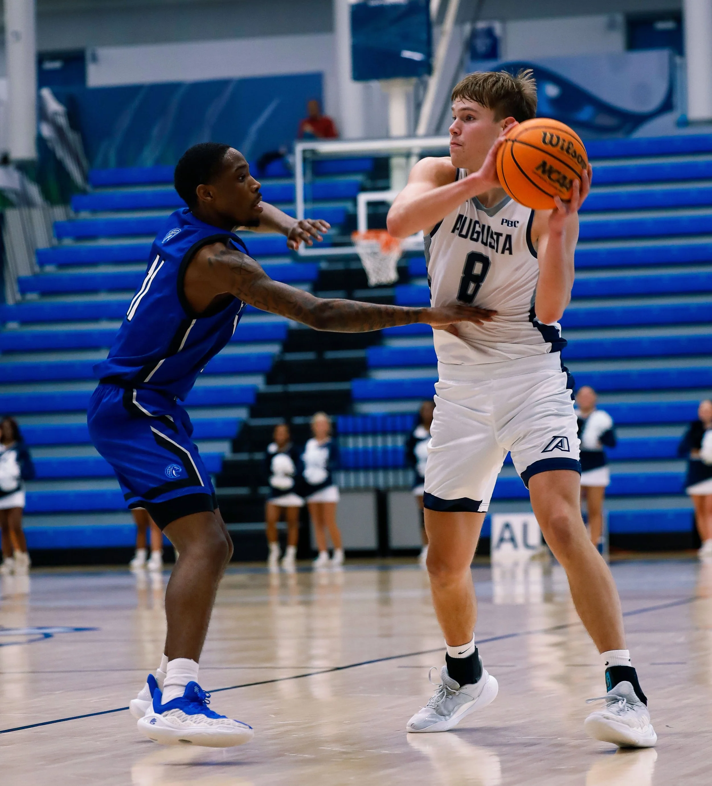  AU’s Elias Palsson (8) looks for an open teammate in the Jaguars’ 79-62 loss to Fayetteville State. At the top of the page, Oliver Lucas (13) goes up for two of his six points for AU. (photos by Lydia Williams/the Bell Ringer) 