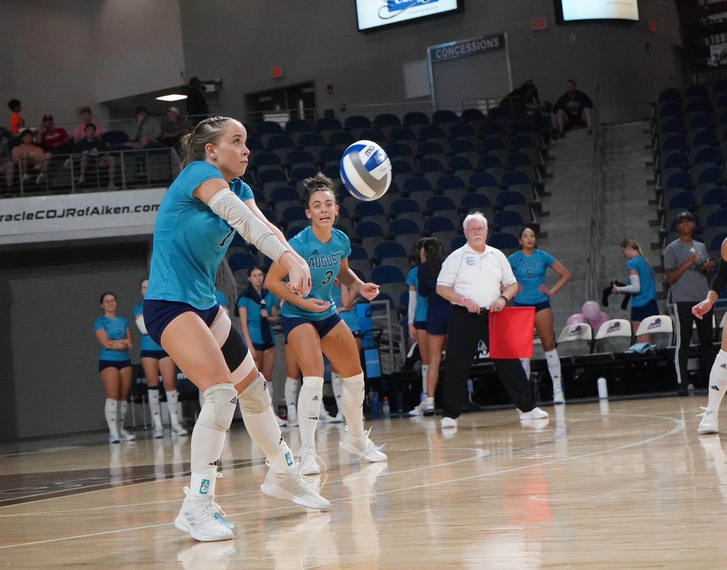  Ally Thees (1) had nine digs as the AU volleyball team eased to a straight-sets victory over Flagler in St. Augustine, Fla., on Friday, Oct. 27. Teammate Rylie Harris (3) watches. At the top of the page, Thees serves, as the Jaguars won for the 20th time this season against just four losses. (photos by Domonic Macias) 
