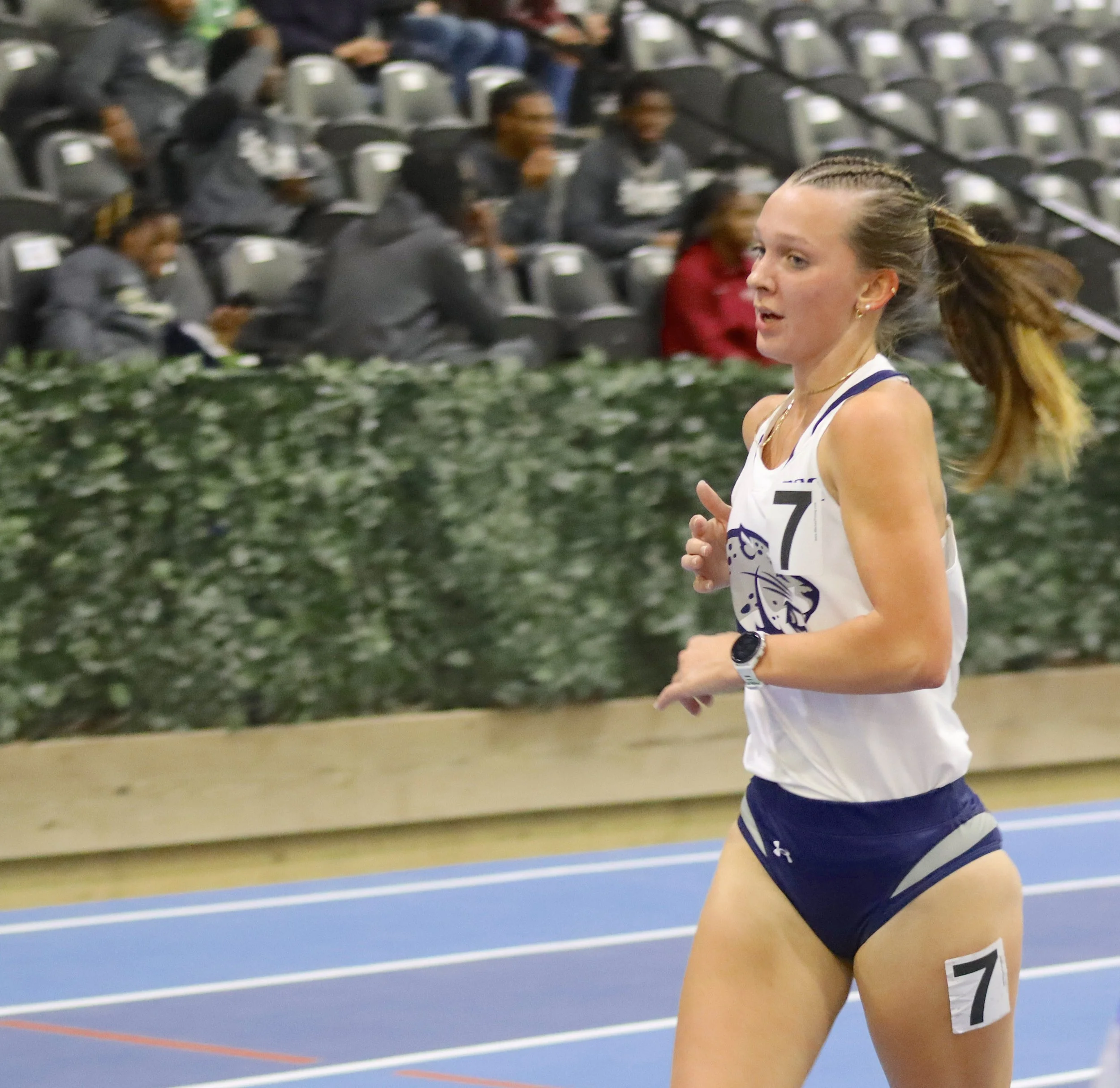  AU’s Carlee Hodges, a freshman from Richmond Hill, took seventh in the women’s 5,000 meters at the Tryon Winter Classic indoor track and field meet in Mill Spring, N.C. At the top of the page, Jaguar sophomore Lily McDonald took fifth in the 5K. (photos by Anna Biondolillo/the Bell Ringer) 