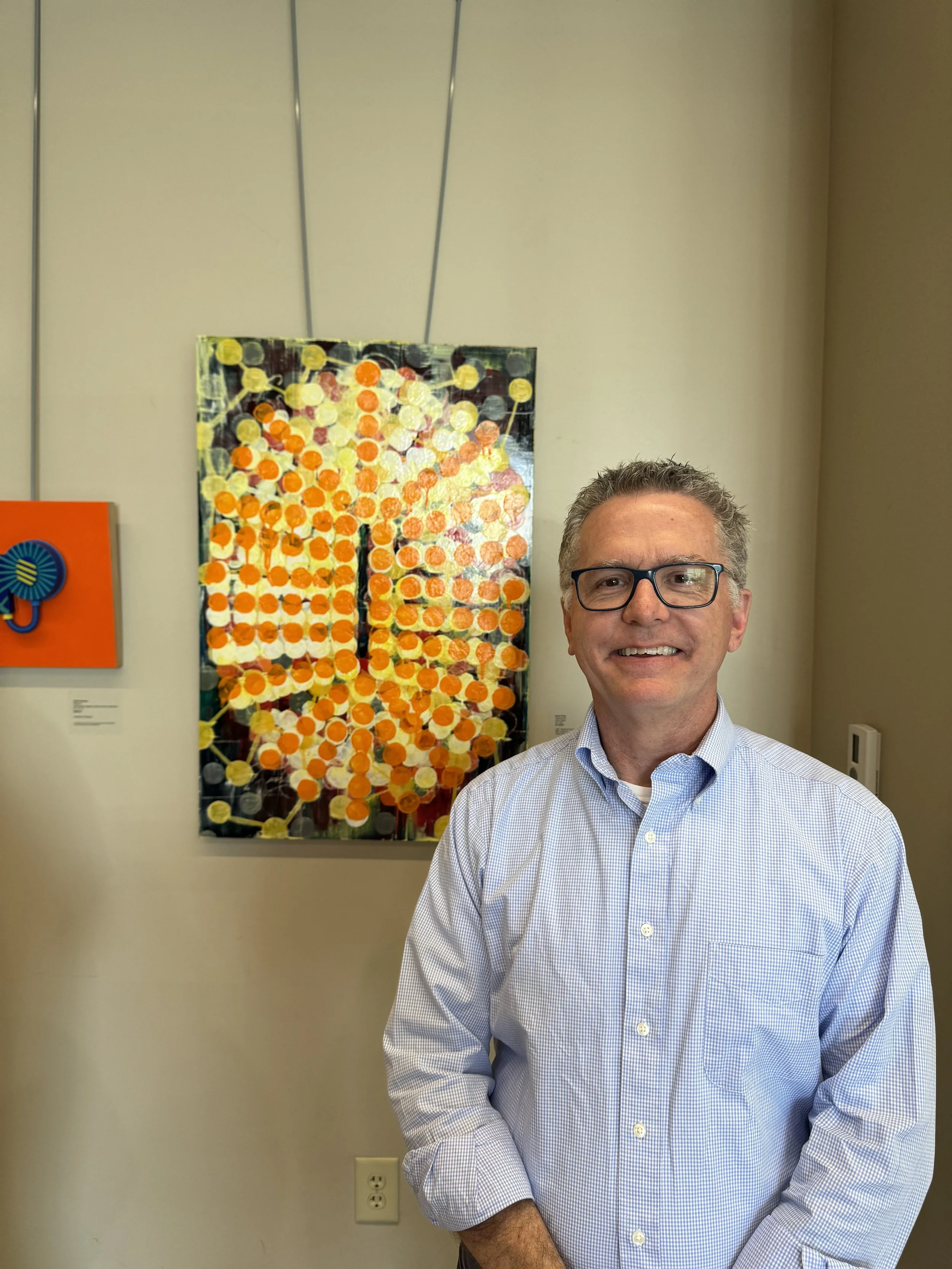  Scott Thorp next to his artwork.  (photo by Makenzy Veldboom)  