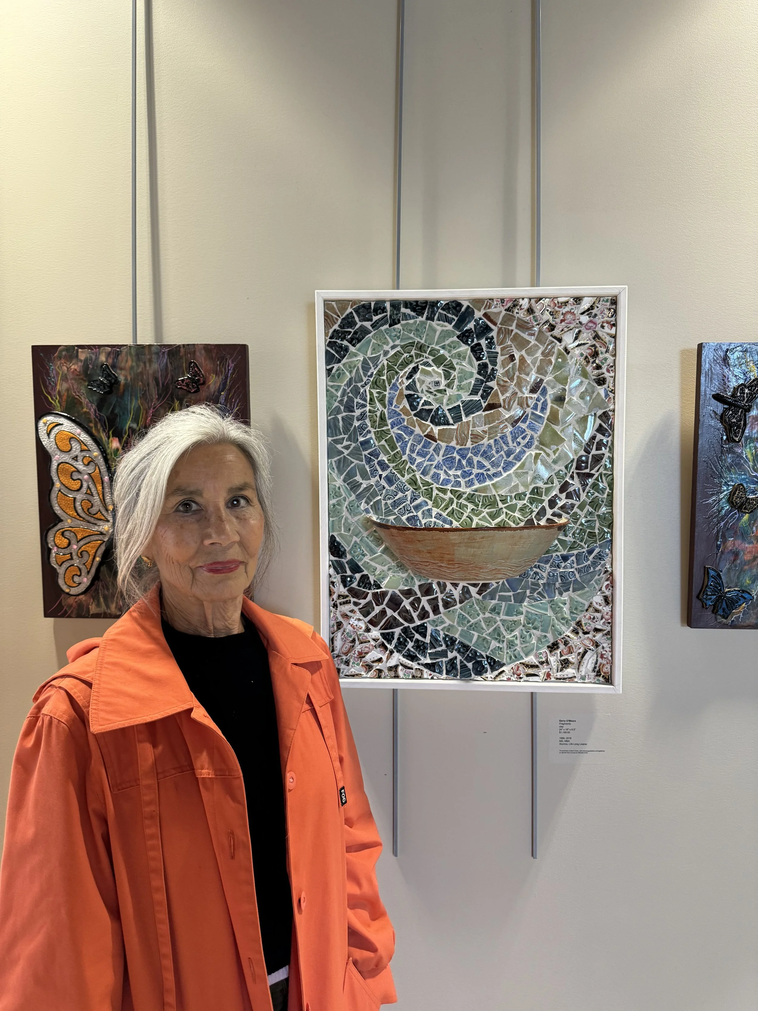  Gerry O’Meara next to her artwork.  (photo by Makenzy Veldboom)  