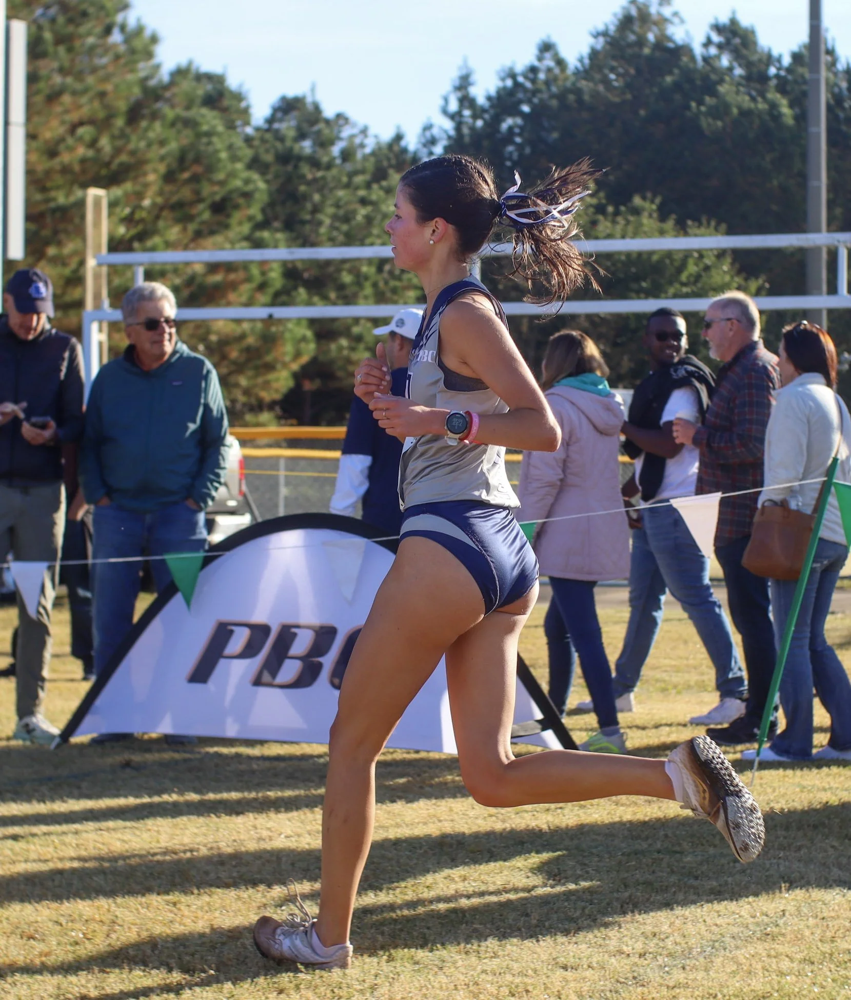  Gabby Jourdain shows her form during the Peach Belt Conference championship meet in Milledgeville last October. At the top of the page, Jourdain (81) competes in an indoor track meet in North Carolina. (photos by Anna Biondolillo/the Bell Ringer) 