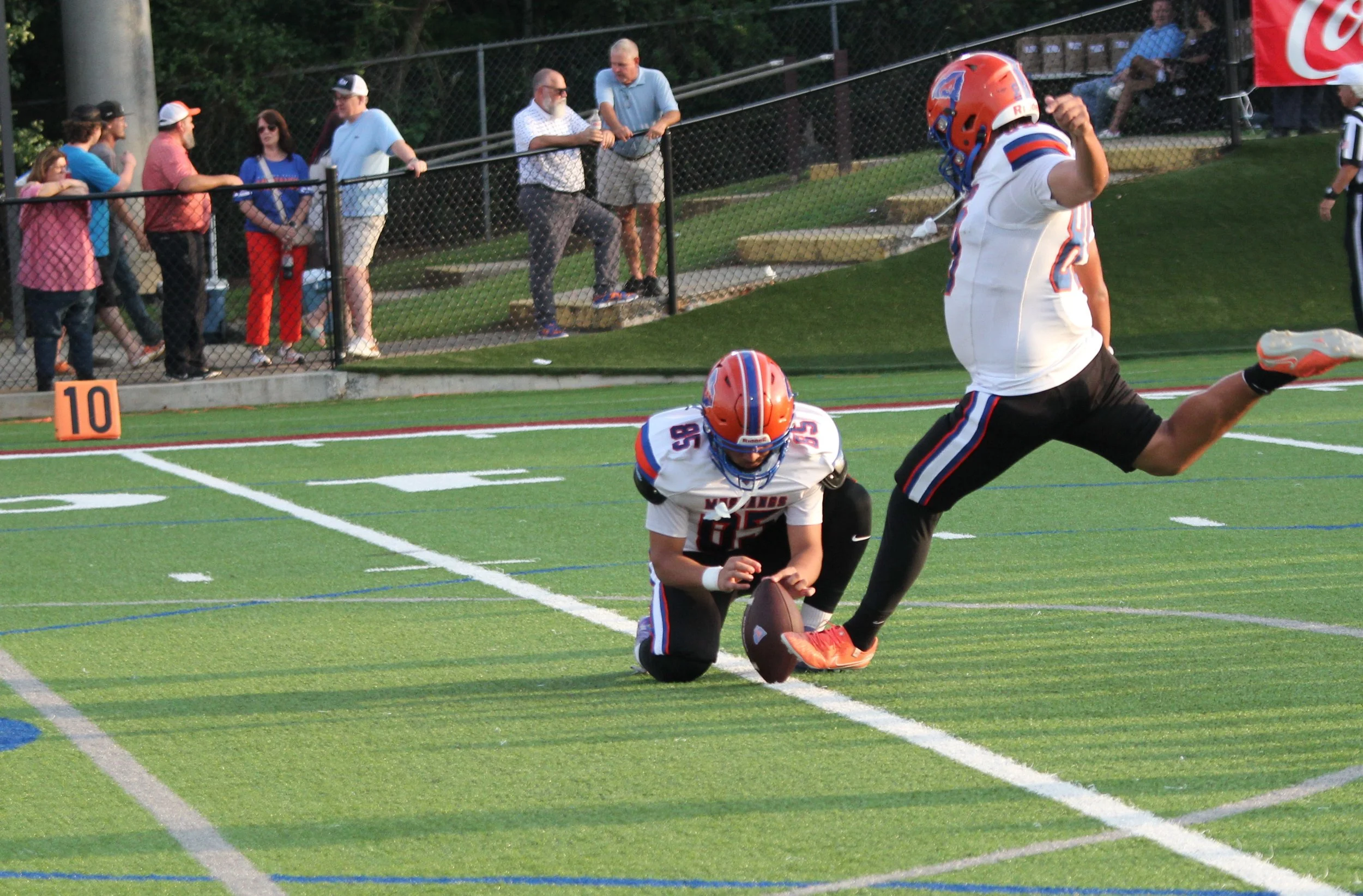  Midland Valley place-kicker Jason Larios made all six of his PATs and consistently placed his kickoffs in the Lakeside end zone. (Bell Ringer staff photo) At the top of the page, Dallas Dundy runs 88 yards for the last touchdown of the game. (photo by Anna Biondolillo/the Bell Ringer) 