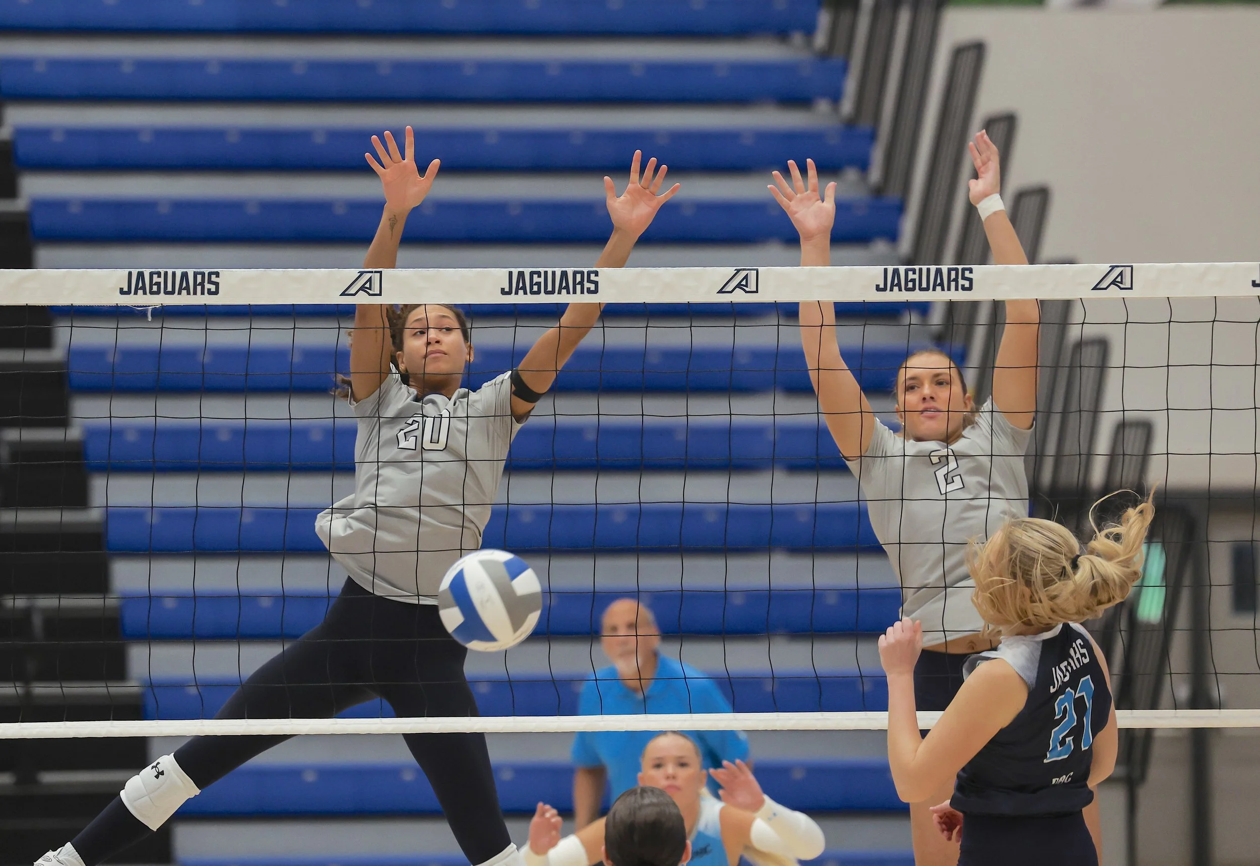  Layne Witherspoon (20) and Lauren Nelson (2) go up for the block on an attack by Patrycja Kabala. At the top of the page, Ronya Shackleford goes for the kill. (photos by Lydia Williams/the Bell Ringer) 