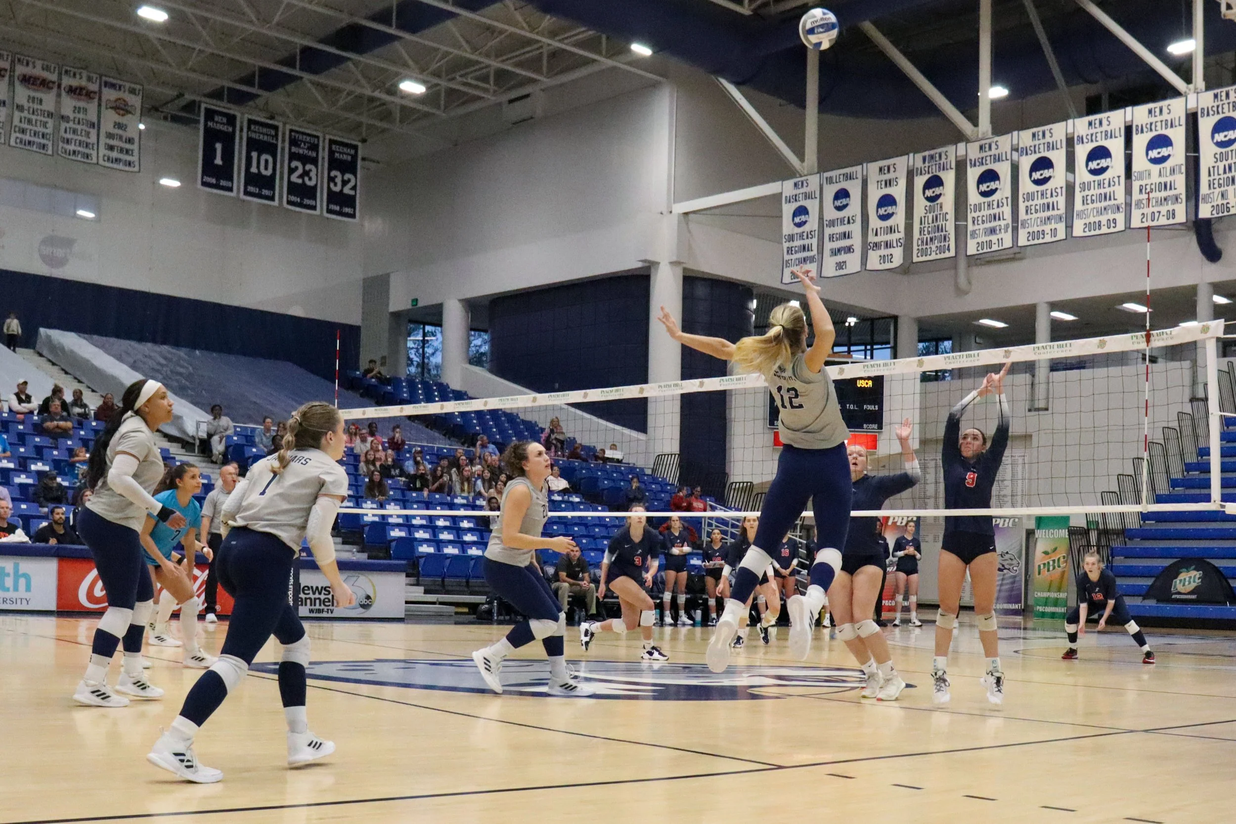  Abigail LeVines (12) goes up for the kill for AU in the Peach Belt semifinal against USC Aiken. At the top of the page, Jazmyn Wheeler (16) chases down the ball as Kayli Cleaver (11) watches. (photos by Madison Keel) 