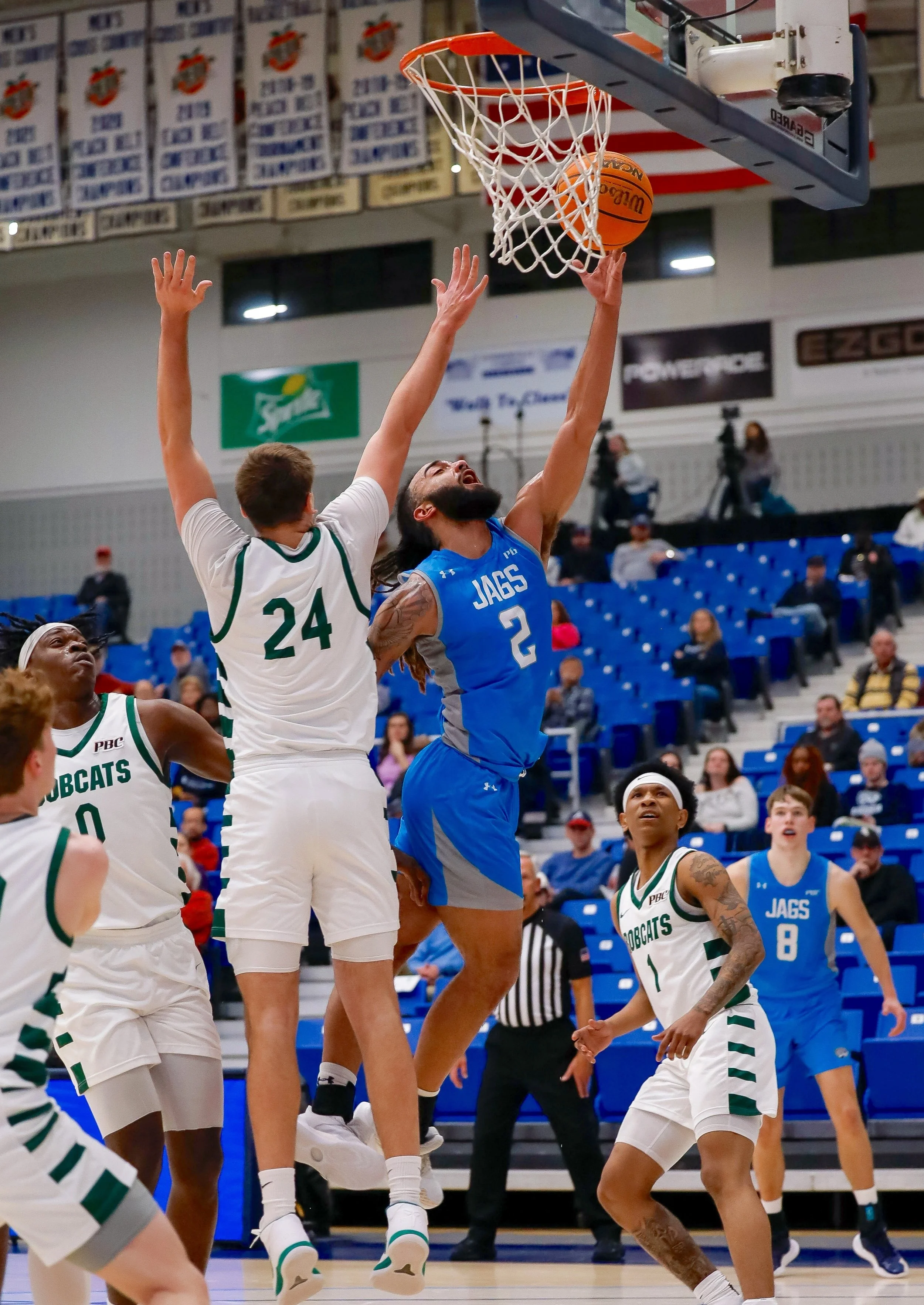  AU’s Demitri Gardner (2) had 23 points and surpassed the 1,000-point milestone for his career in the Jaguars’ 88-76 win over Georgia College at Christenberry Fieldhouse. At the top of the page, Augusta guard John St. Germain III (4) guards the Bobcats’ Khalil Green on a night when St. Germain had 10 points, seven assists and three steals. (photos by Lydia Williams/the Bell Ringer) 