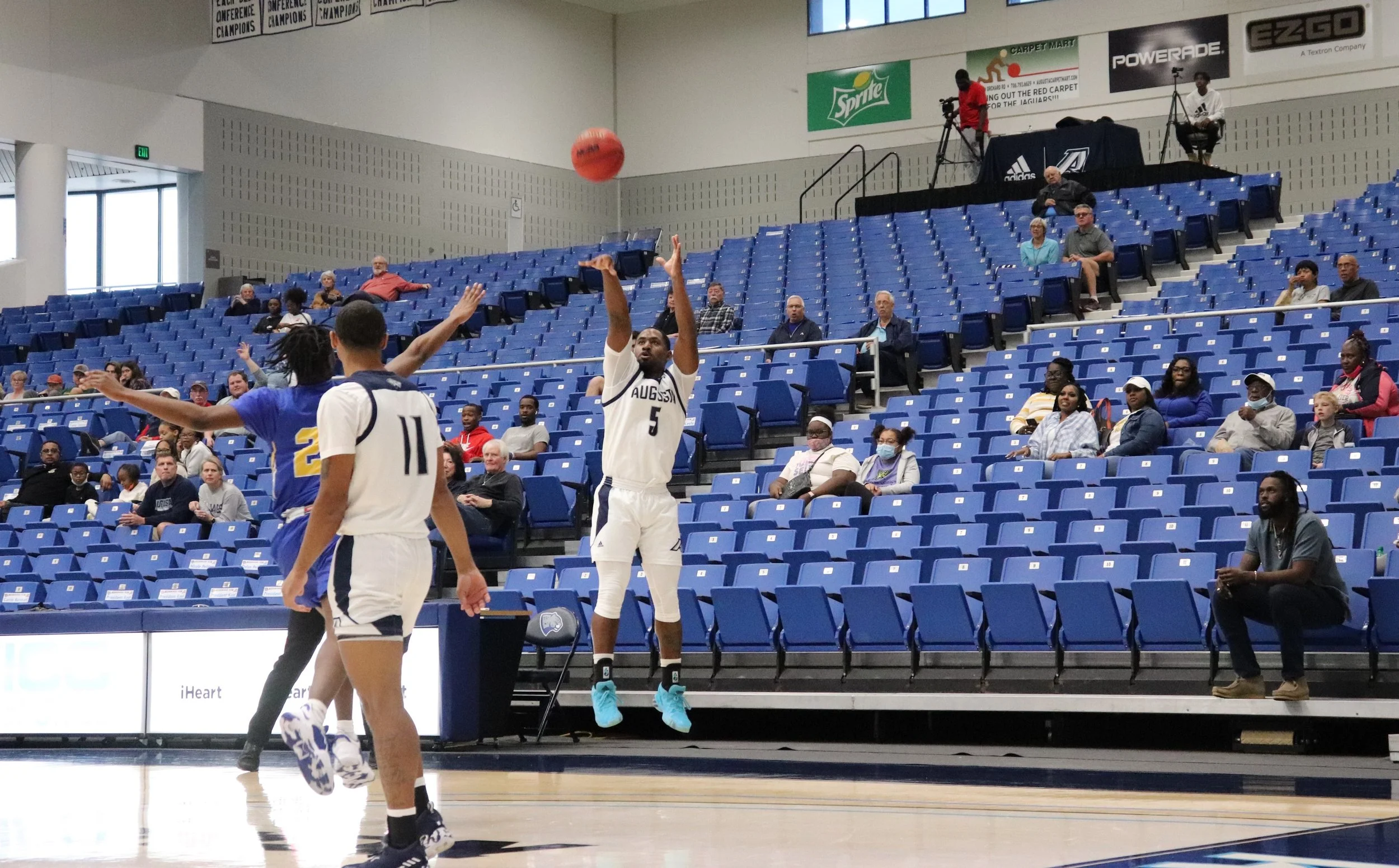  Miguel Arnold (5) nails another 3-pointer in a game in which he made six of them. (photo by Shelbie Summerlin) At the top of the page, AU’s Ja’Queze Kirby (13) shoots over Allen’s Michael Ferguson (22) on an afternoon when the freshman scored 23 points for the 10th-ranked Jaguars. (staff photo) 