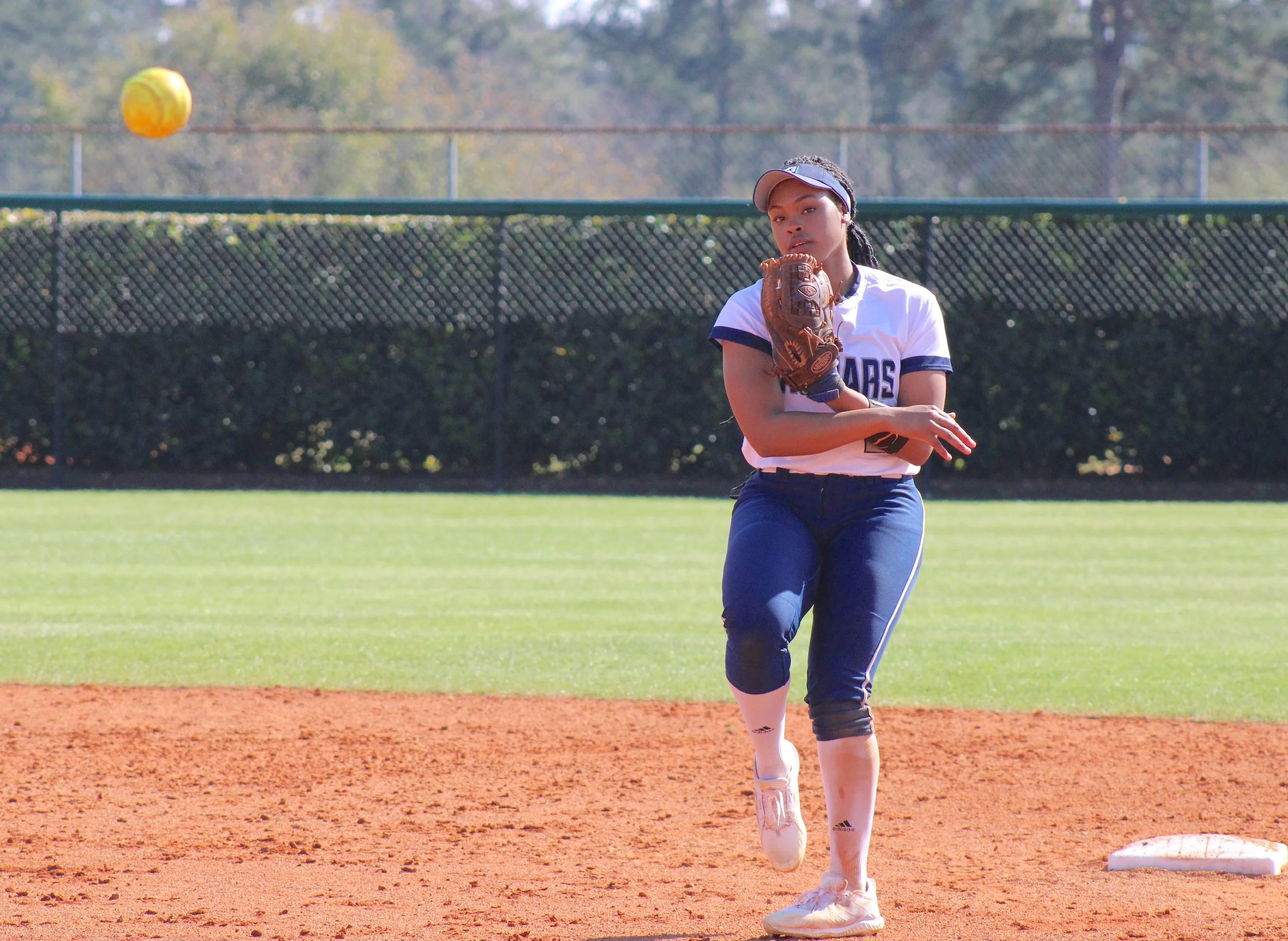  AU shortstop Jakayla Sullivan fires to first base. At the top of the page, Bailee Roberts had three hits, including a three-run homer, in the doubleheader at Wingate. (photos by Chris Rickerson) 