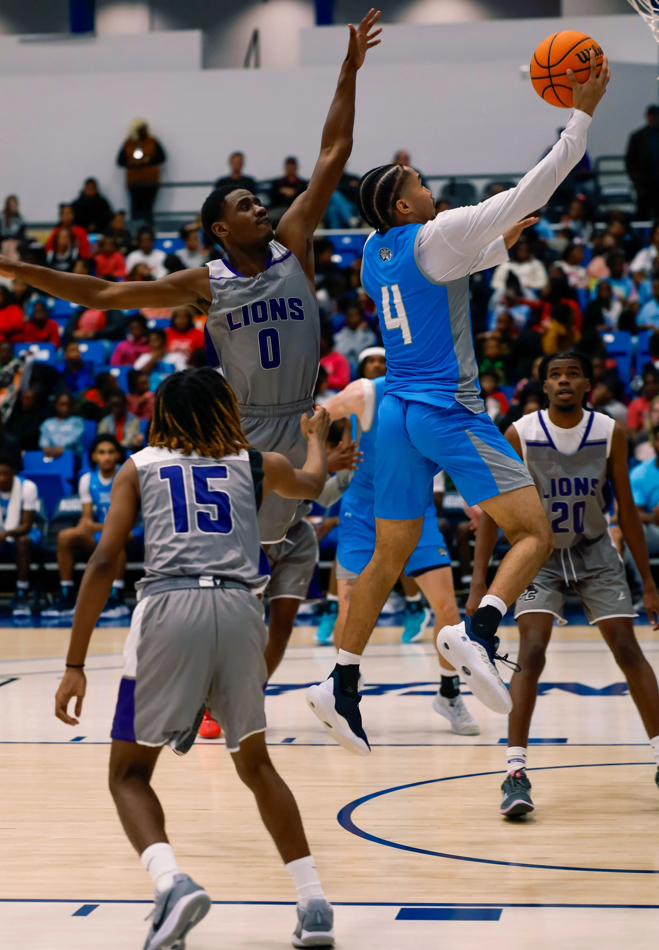  AU point guard John St. Germain III (4) drives to the basket for two of his 19 points in the Jaguars’ 91-60 win over Paine College. At the top of the page, Demitri Gardner (2) pushes the ball to the hoop on a day when he scored 18 points and grabbed five rebounds. (photos by Lydia Williams/the Bell Ringer) 