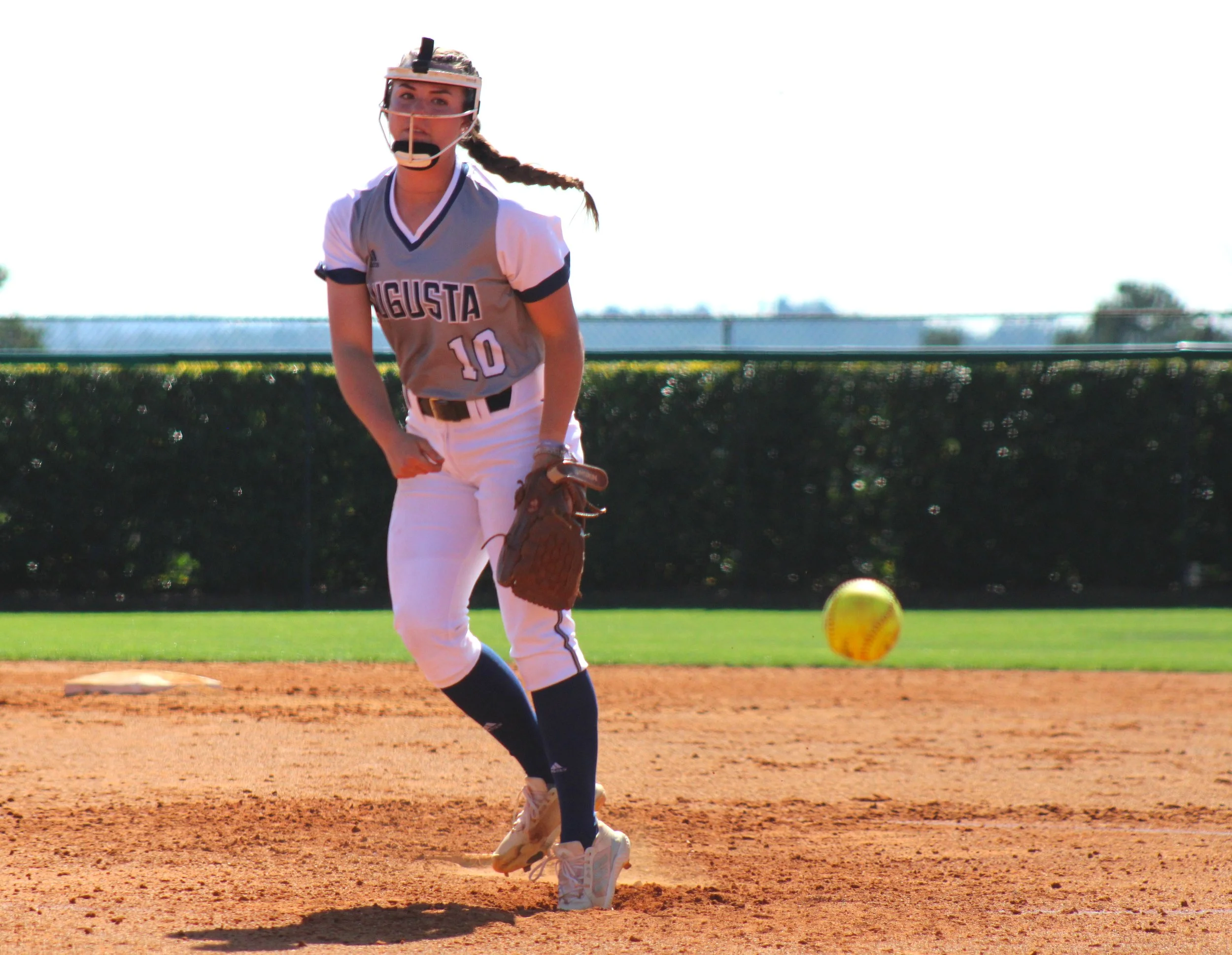  Mary Tillman struck out 13 as the Jaguar softball team defeated previously unbeaten Belmont Abbey 4-3. At the top of the page, Paige Patterson gets a hit for AU; Patterson had two homers in the game. (photos by Chris Rickerson)  