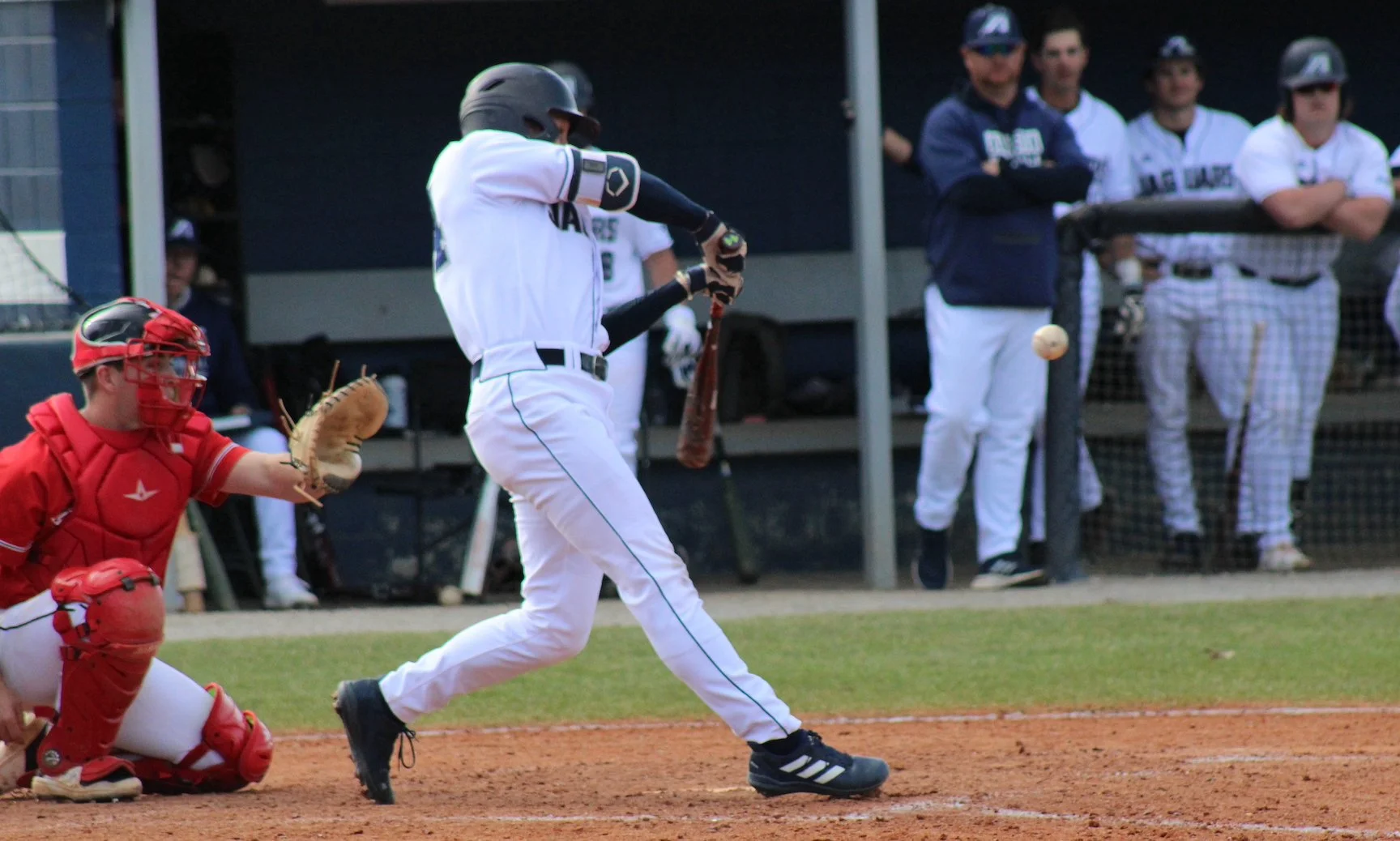  Jared Martin (44) takes a swing against the Cavaliers. At the top of the page, the Jaguars’ Ben Markiewicz (7) sends the ball toward the fence; he had two home runs on the weekend in AU’s three-game sweep of the Cavs. (photos by Chris Rickerson) 