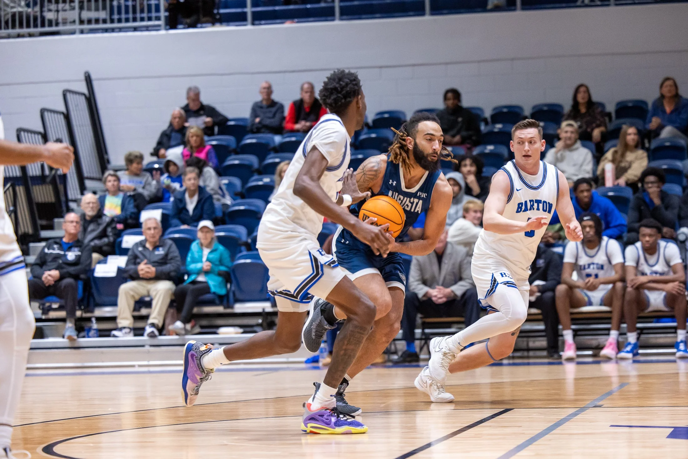  Demitri Gardner (with the ball) provided a big lift with 43 points in two games for the Jaguars, who opened the season with a pair of road wins. At the top of the page, Max Amadasun (17) was the difference on Friday night with 26 points and 15 rebounds in the 96-86 win over Mount Olive. (photos by Paula Toole, AU Athletics) 