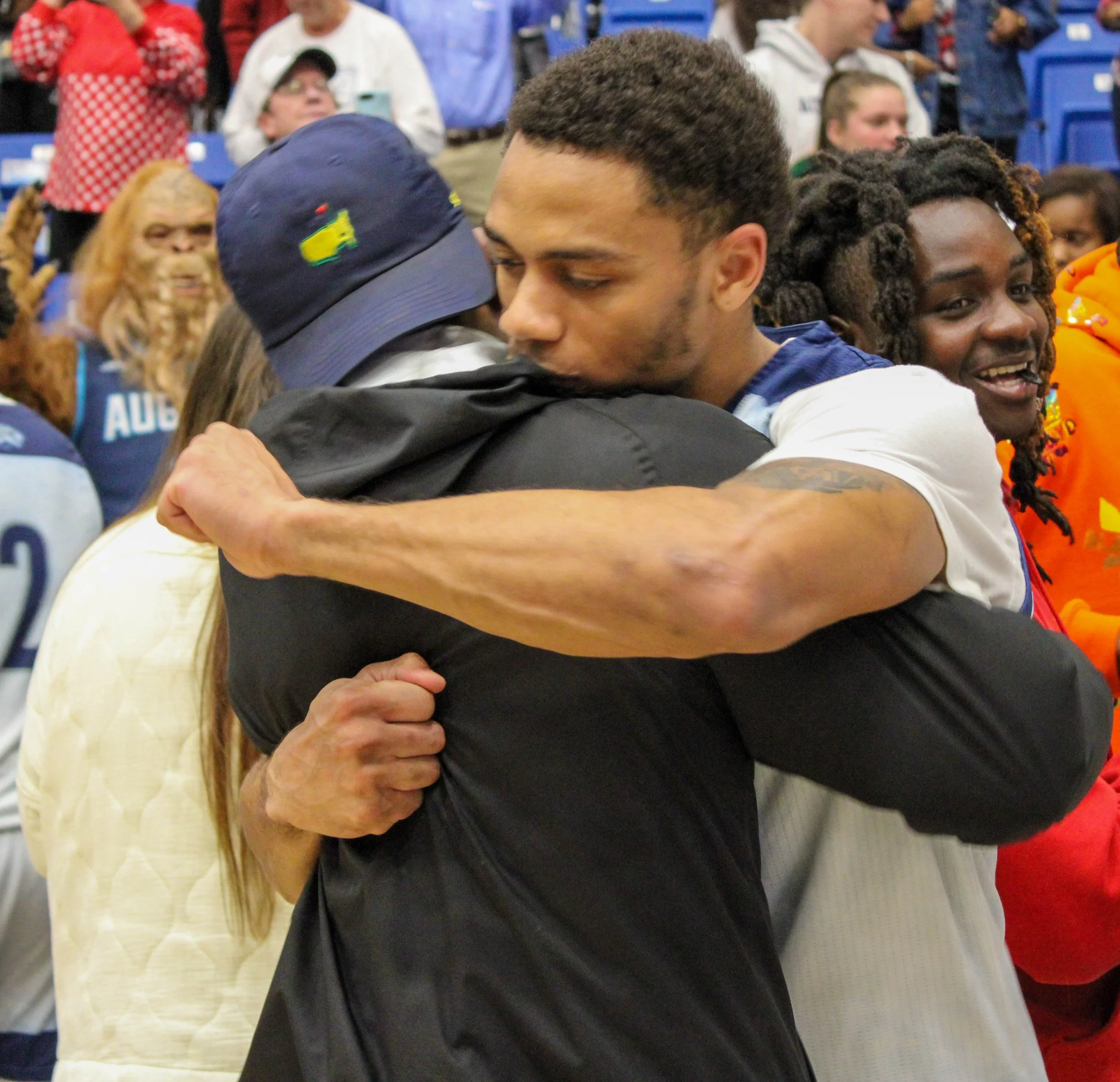  Darren Lucas-White gets a hug after he scored nine points and helped the Jaguars to the narrow victory. (photo by Chris Rickerson) 