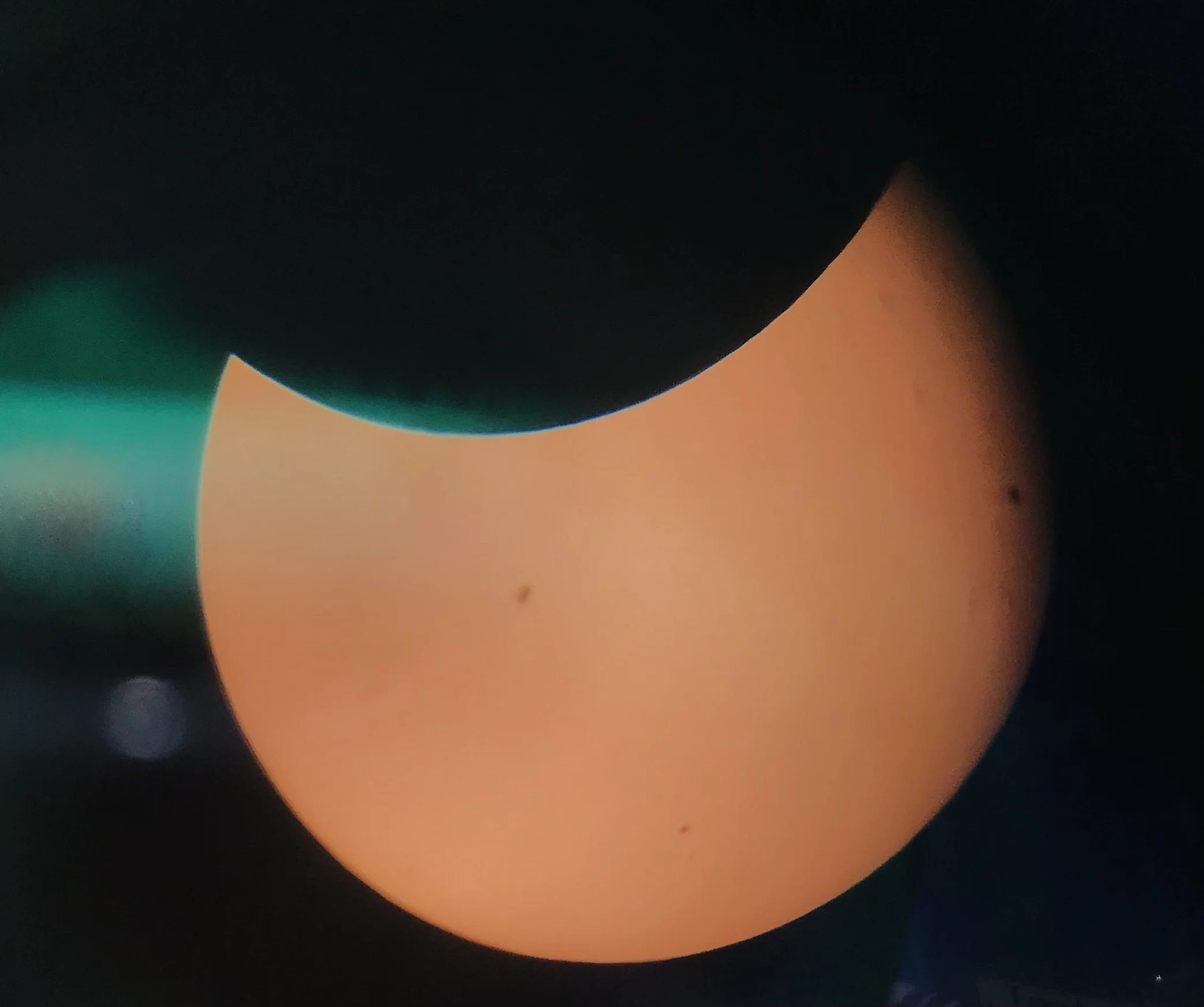  The moon passed in front of the sun on Monday, April 8, marking a partial solar eclipse for the Augusta area. At top of page, a young boy views the eclipse through a telescope.  (photos by Rakiyah Lenon)  