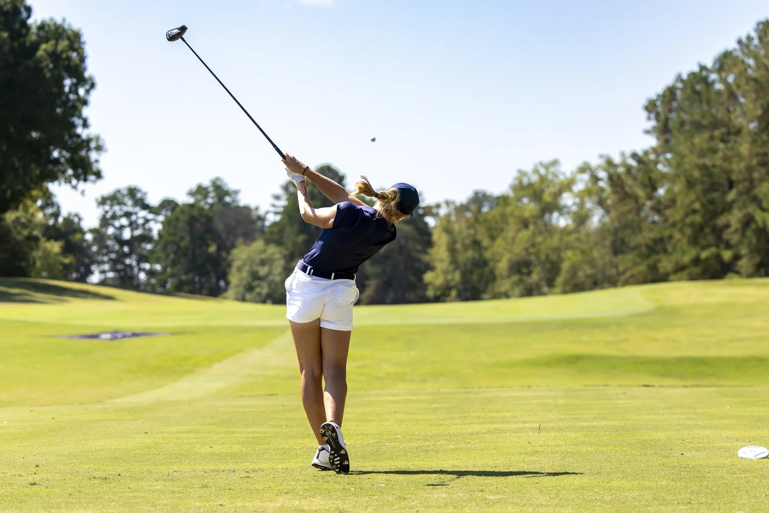  Augusta’s Keira Gonzalez-McCarthy shows her from with the driver en route to a victory in the Furman Invitational. At the top of the page, Gonzalez-McCarthy would finish at 8 under par to win medal play by one shot. (photos by Paula Toole, AU Athletics) 