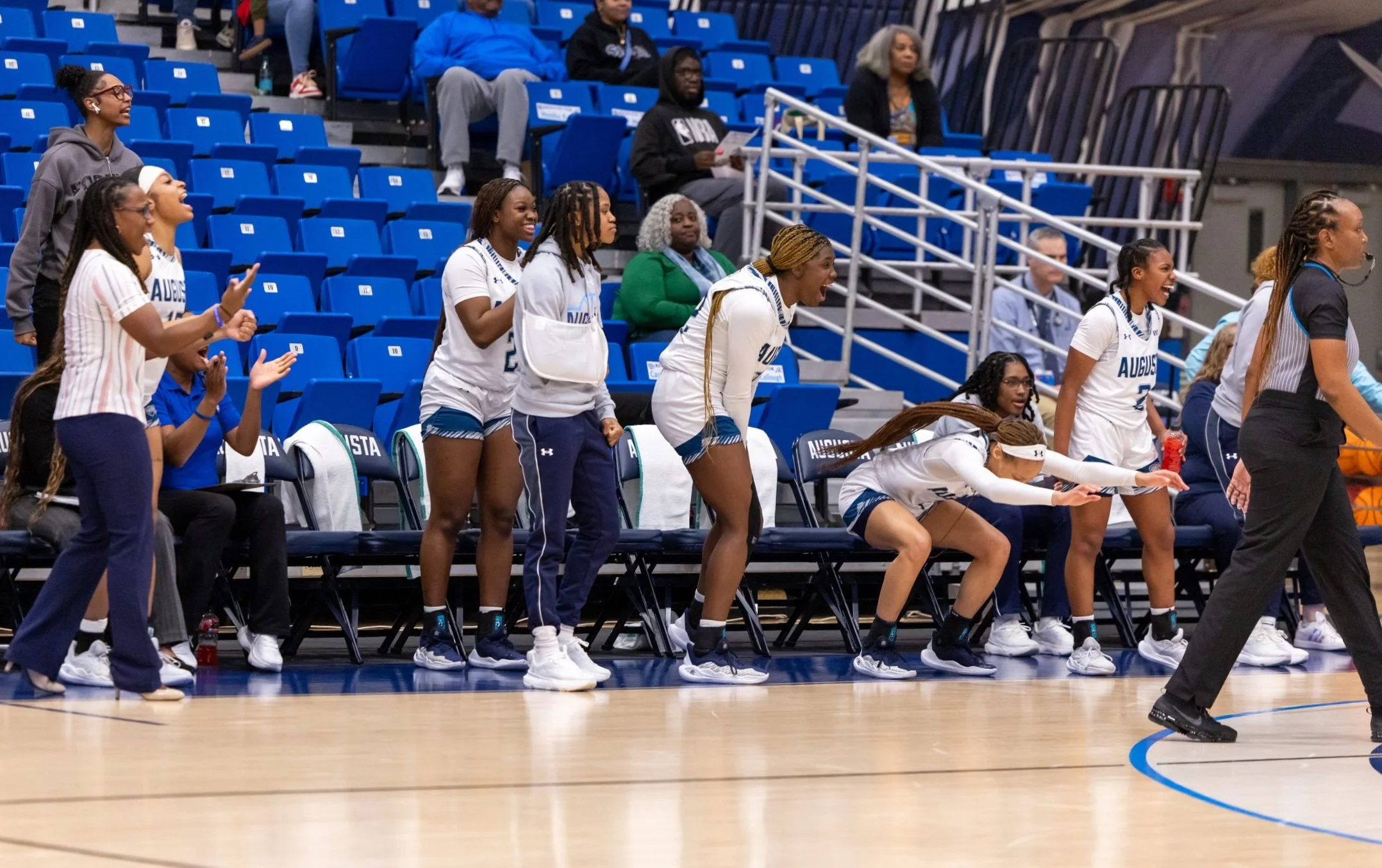  AU bench after a basket in the second half (Photo by Paula Toole/AU Athletics.) Top: AU’s Mone Florence puts up a contested layup against Lander. (Photo by Paula Toole/AU Athletics.) 