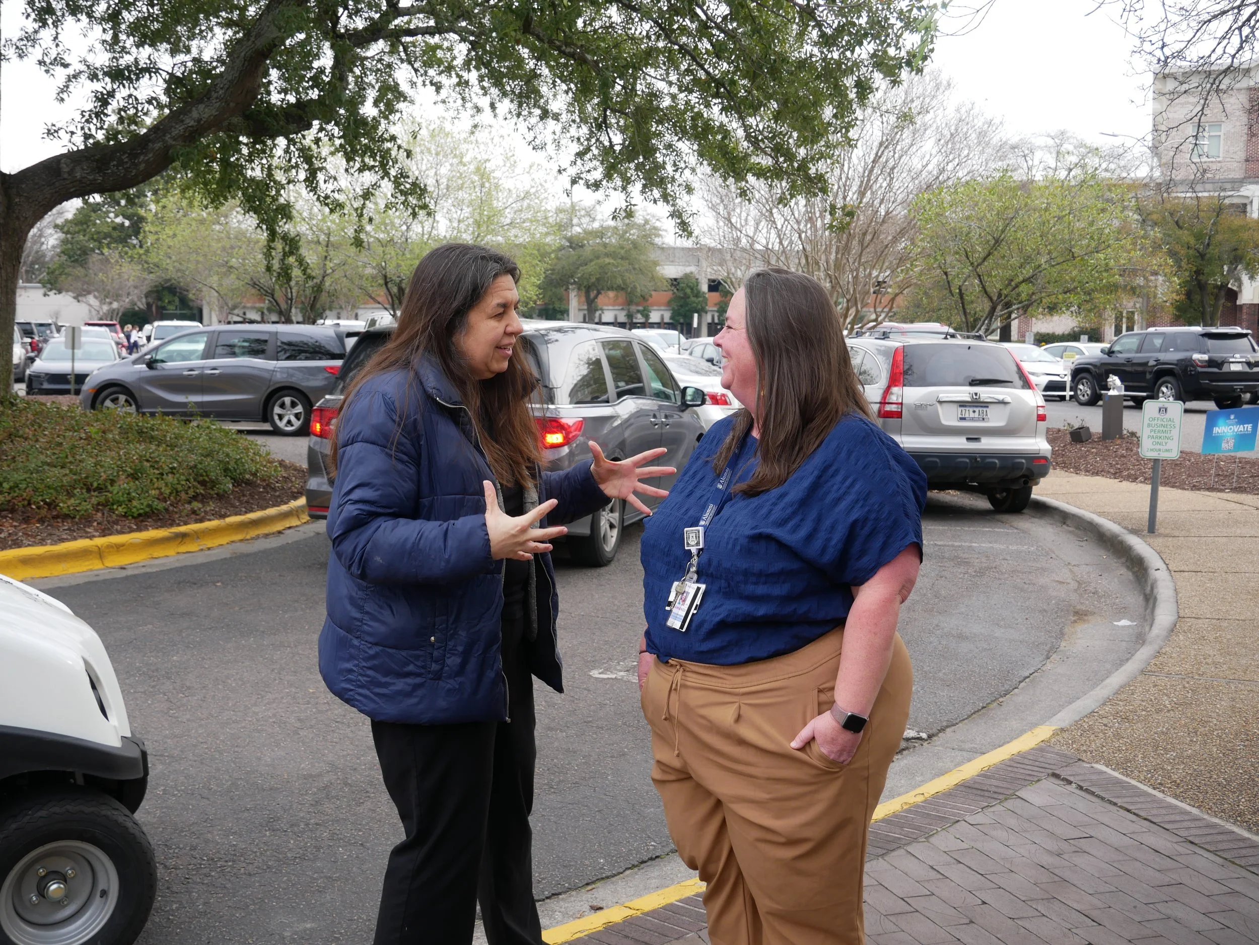  Provost Maggy Tomova talks to staff outside Greenblatt Library. (photo by Caelyn Dockal/the Bell Ringer) 