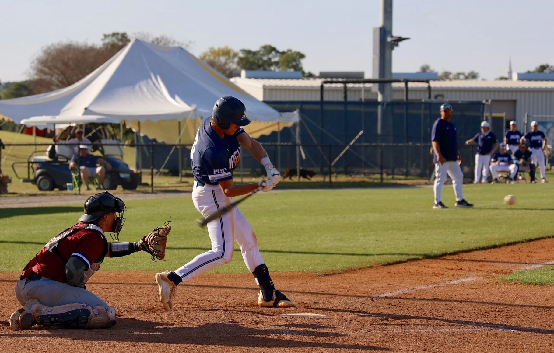  Parker Ingram gets this hit for the Jaguars in the 13-0 win over Emmanuel. At the top of the page, Zach Kwiatokowski is greeted by Rushton Bowles (27), Parker Ingram (10) and Harrison Aulds (8) after Kwiatokowski hit a three-run homer.&nbsp;(photos by Shelbie Summerlin) 