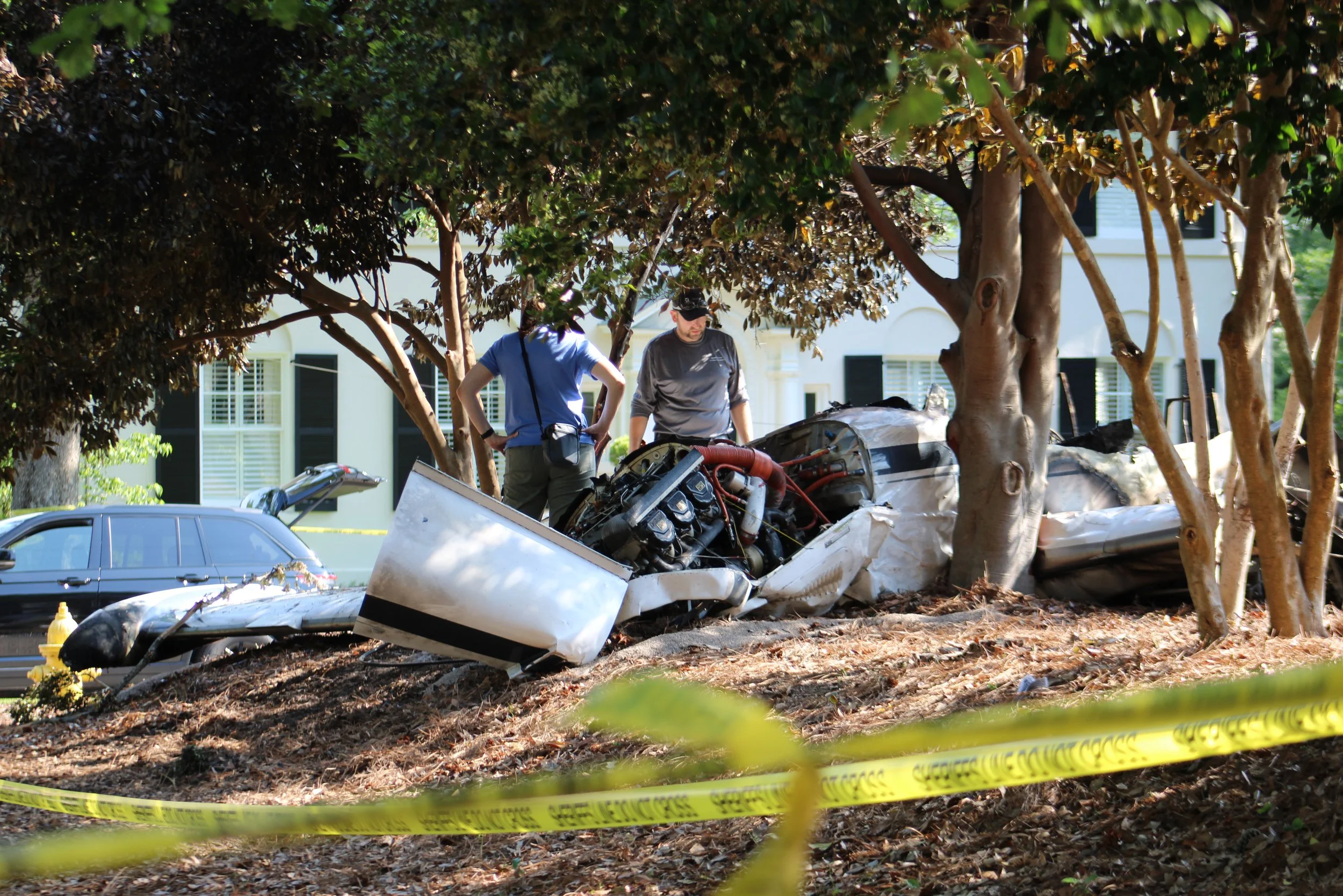  Officials inspect the wreckage of Thursday morning’s airplane crash on Friday, May 3.  (photos by Rakiyah Lenon)  
