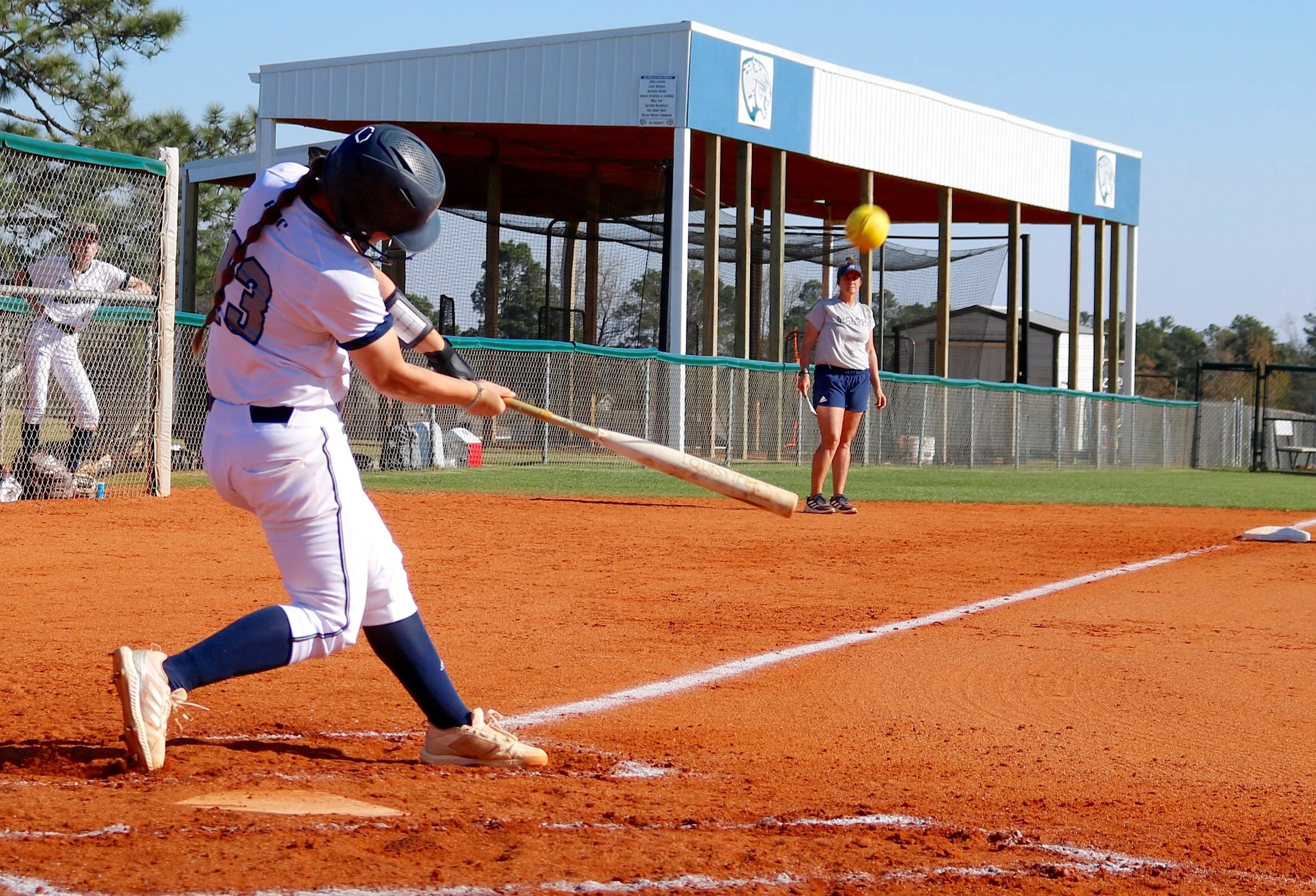  Kali Garrett (13) hits a home run during AU’s 12-2 win over Emmanuel. (photo by Madison Keel) 
