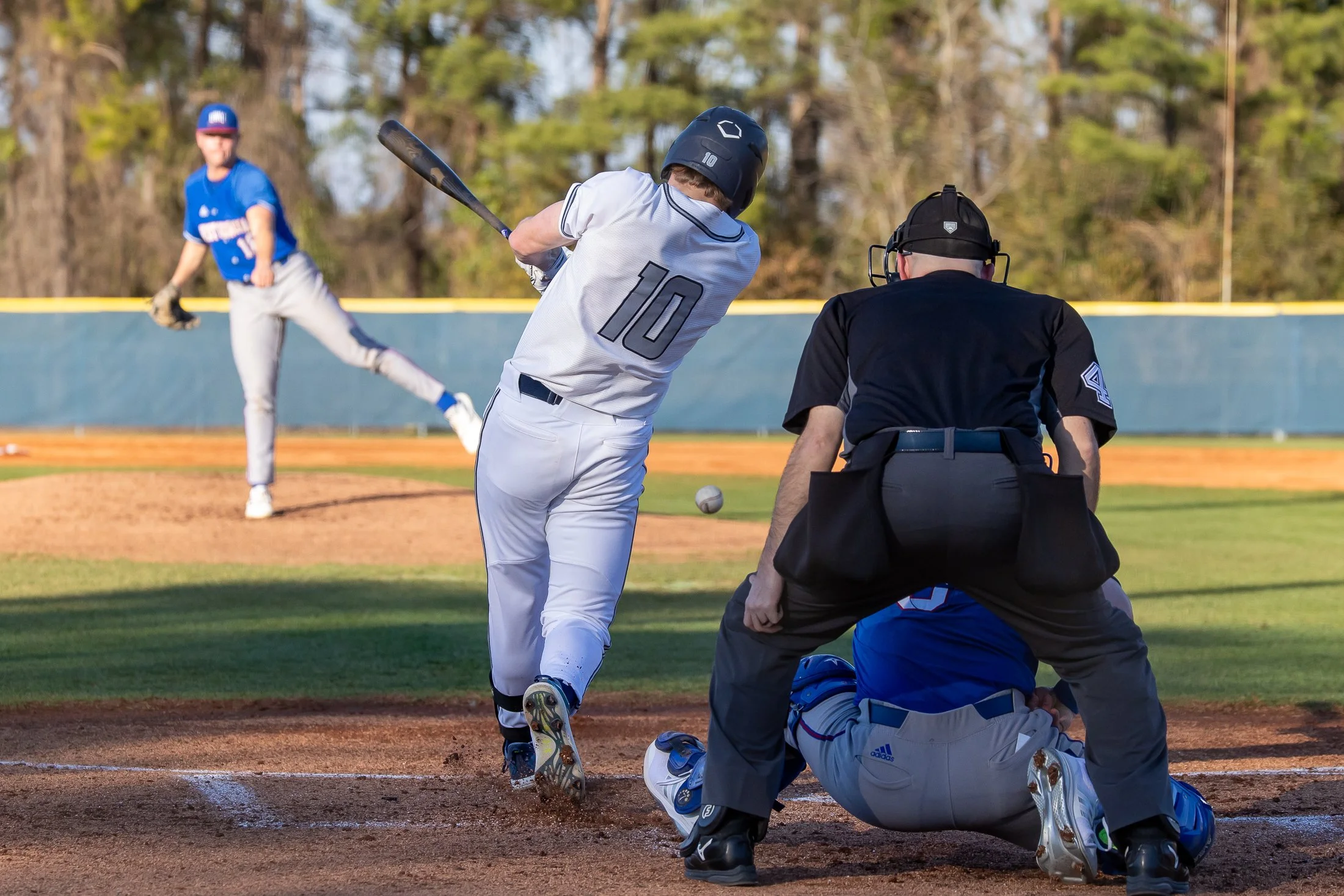  AU’s Parker Ingram (10) gets a single against West Georgia in Friday’s 5-3 Wolves’ win. At the top of the page, right-hander Mason Bernard (34) got the start for the Jaguars in the season opener, and he pitched five innings and allowed just two runs. (photos by Paula Toole, AU Athletics) 